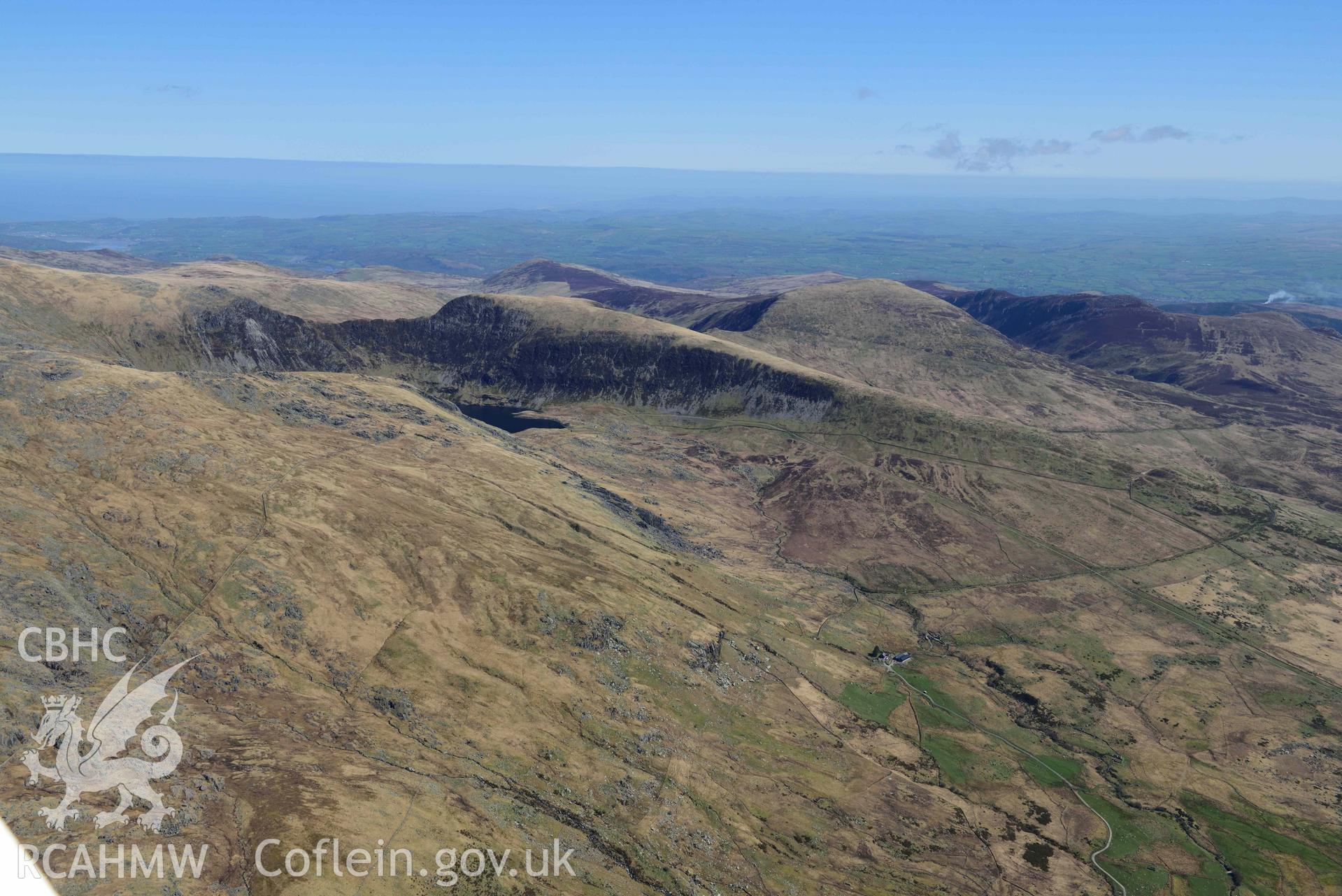 Upland landscape, Glan Llugwy and Afon Llugwy, view from west. Oblique aerial photograph taken during the Royal Commission’s programme of archaeological aerial reconnaissance by Toby Driver on 20 April 2018.