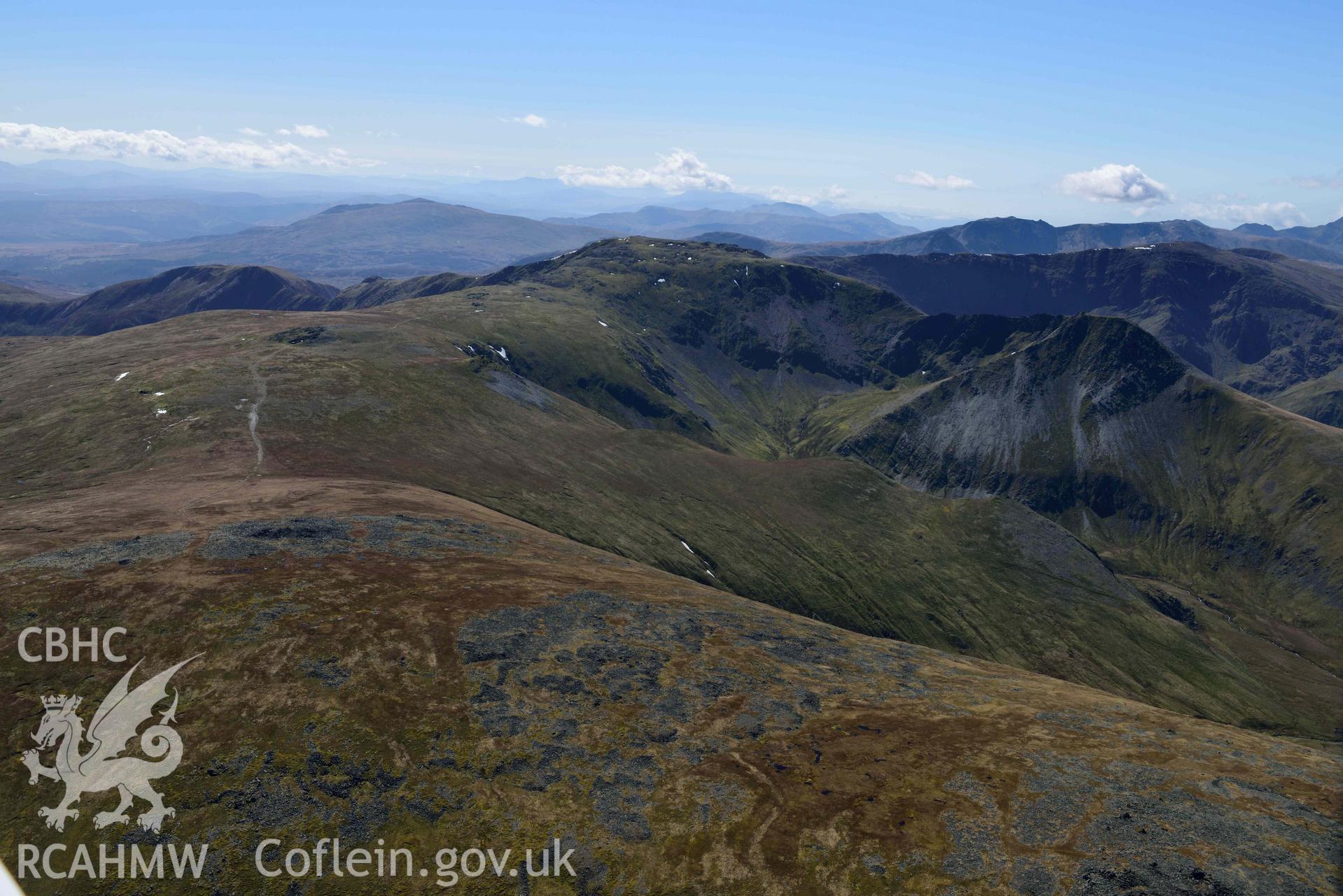 Carnedd Llewelyn and Yr Elen, landscape view from north. Oblique aerial photograph taken during the Royal Commission’s programme of archaeological aerial reconnaissance by Toby Driver on 20 April 2018.