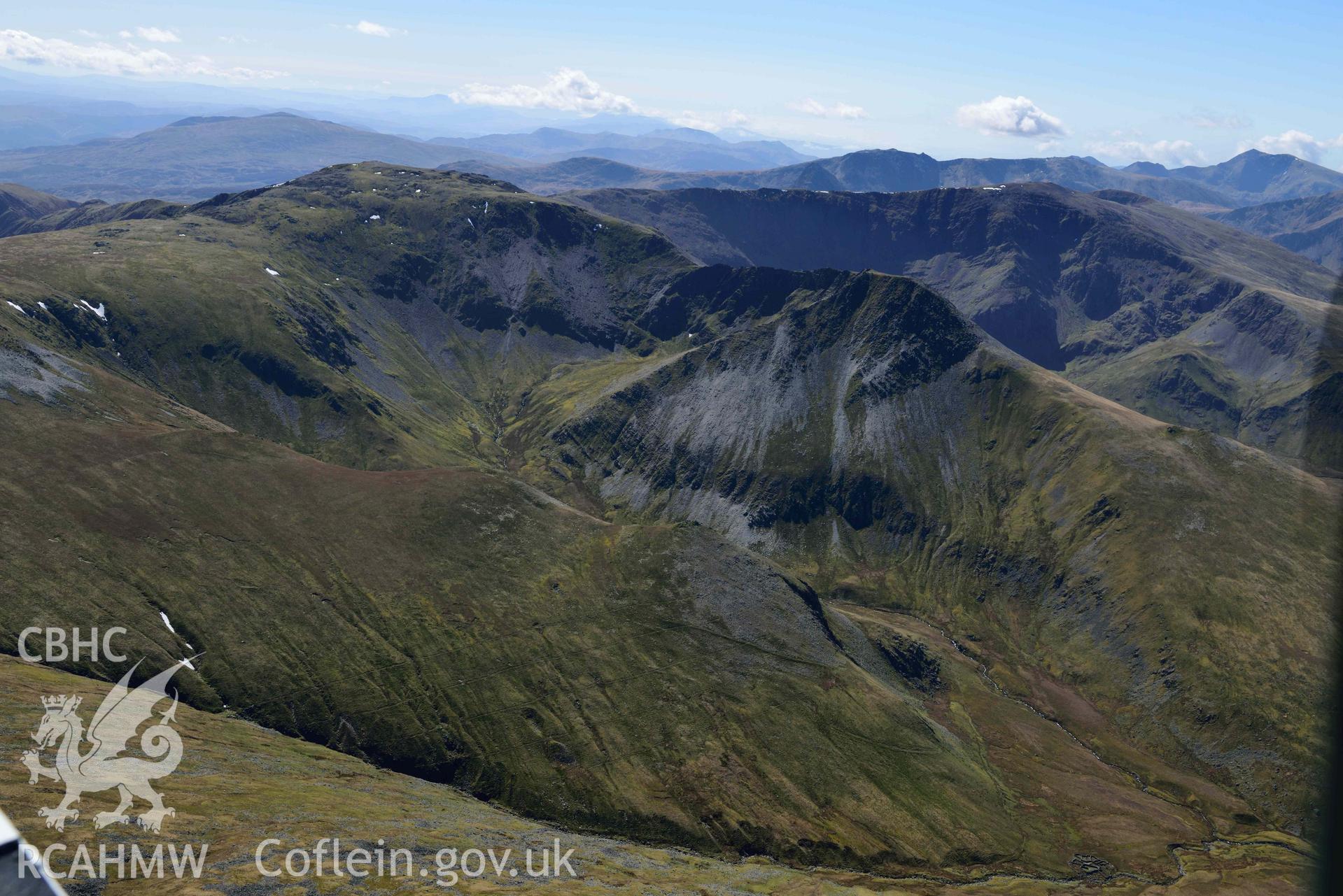 Carnedd Llewelyn and Yr Elen, landscape view from north. Oblique aerial photograph taken during the Royal Commission’s programme of archaeological aerial reconnaissance by Toby Driver on 20 April 2018.