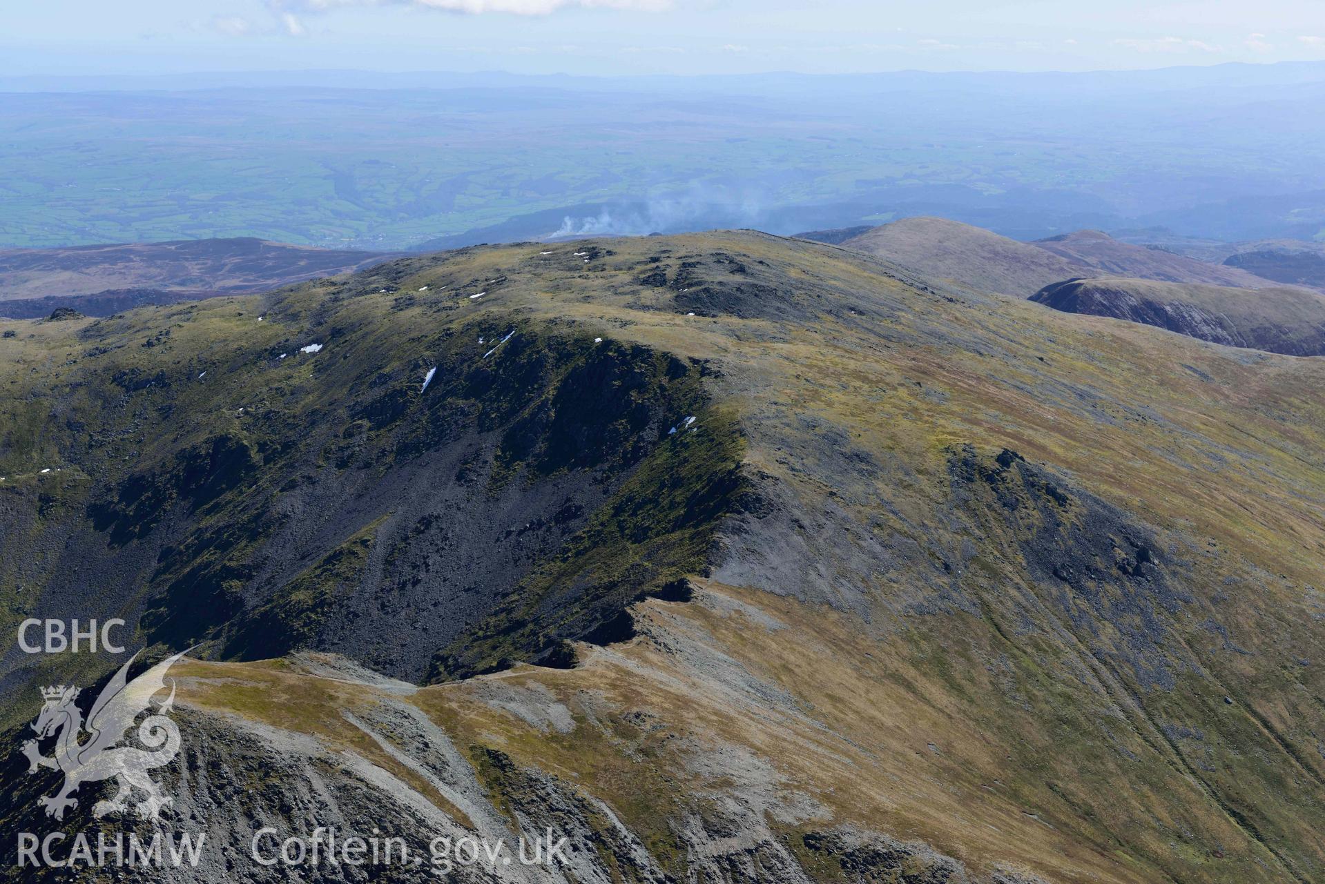 Carnedd Llewelyn, view looking east over Yr Elen. Oblique aerial photograph taken during the Royal Commission’s programme of archaeological aerial reconnaissance by Toby Driver on 20 April 2018.