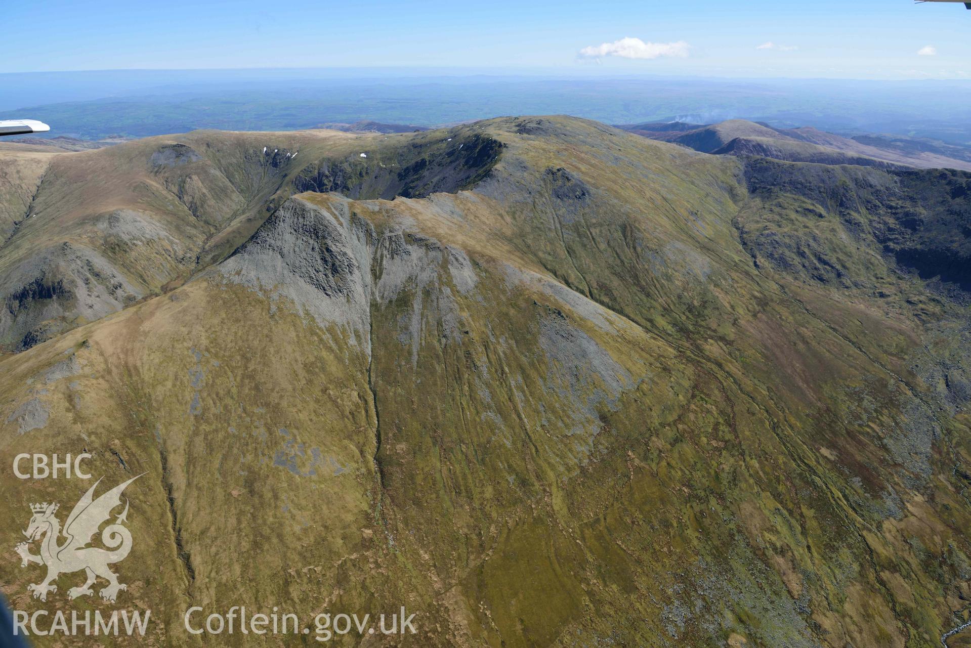 Yr Elen, view north-east to the summit of Carnedd Llewelyn. Oblique aerial photograph taken during the Royal Commission’s programme of archaeological aerial reconnaissance by Toby Driver on 20 April 2018.