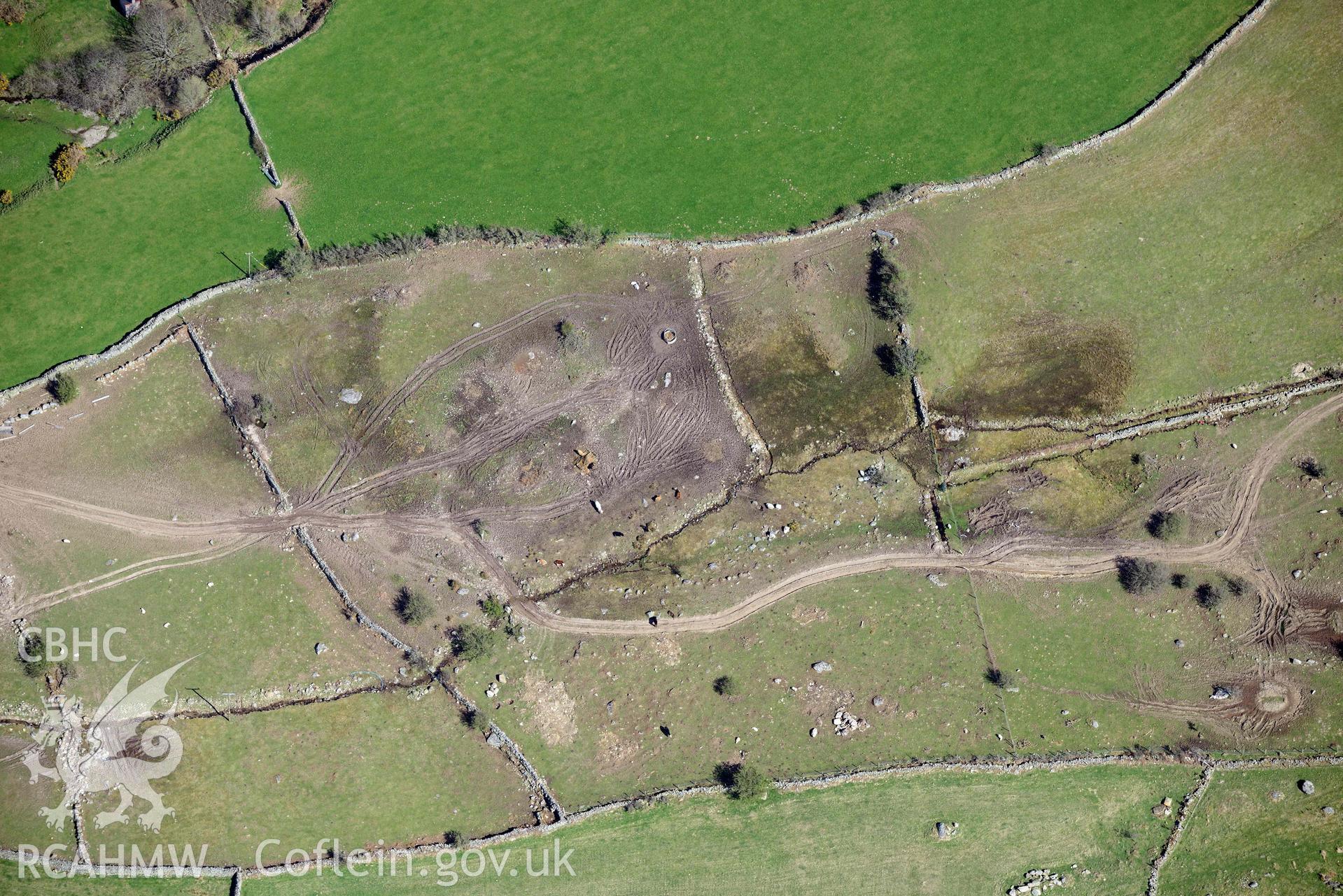 Llanllechid, enclosed hut group, with vehicle damage. Oblique aerial photograph taken during the Royal Commission’s programme of archaeological aerial reconnaissance by Toby Driver on 20 April 2018.