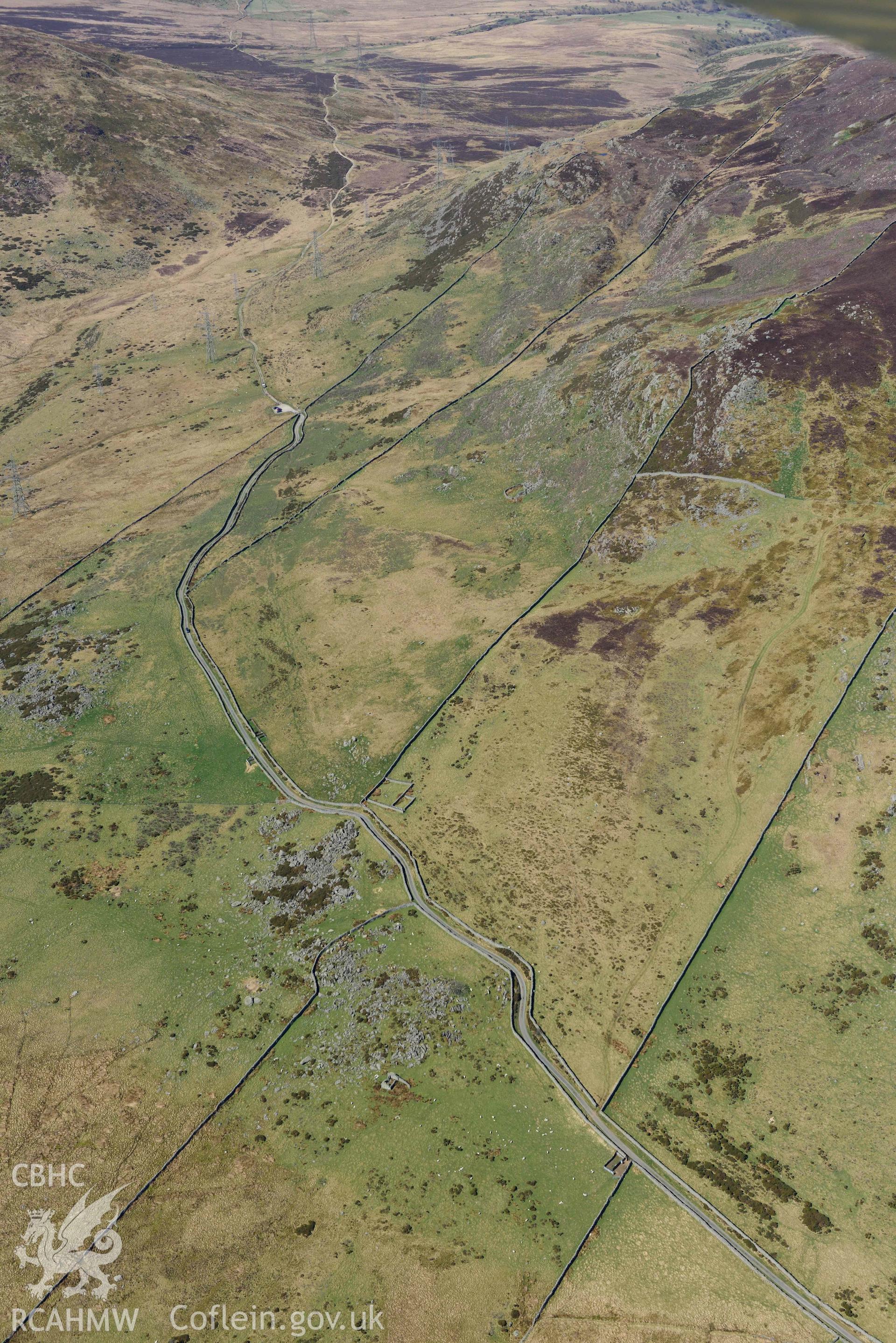 Bwlch y Ddeufaen from Cae Coch, view looking west. Oblique aerial photograph taken during the Royal Commission’s programme of archaeological aerial reconnaissance by Toby Driver on 20 April 2018.