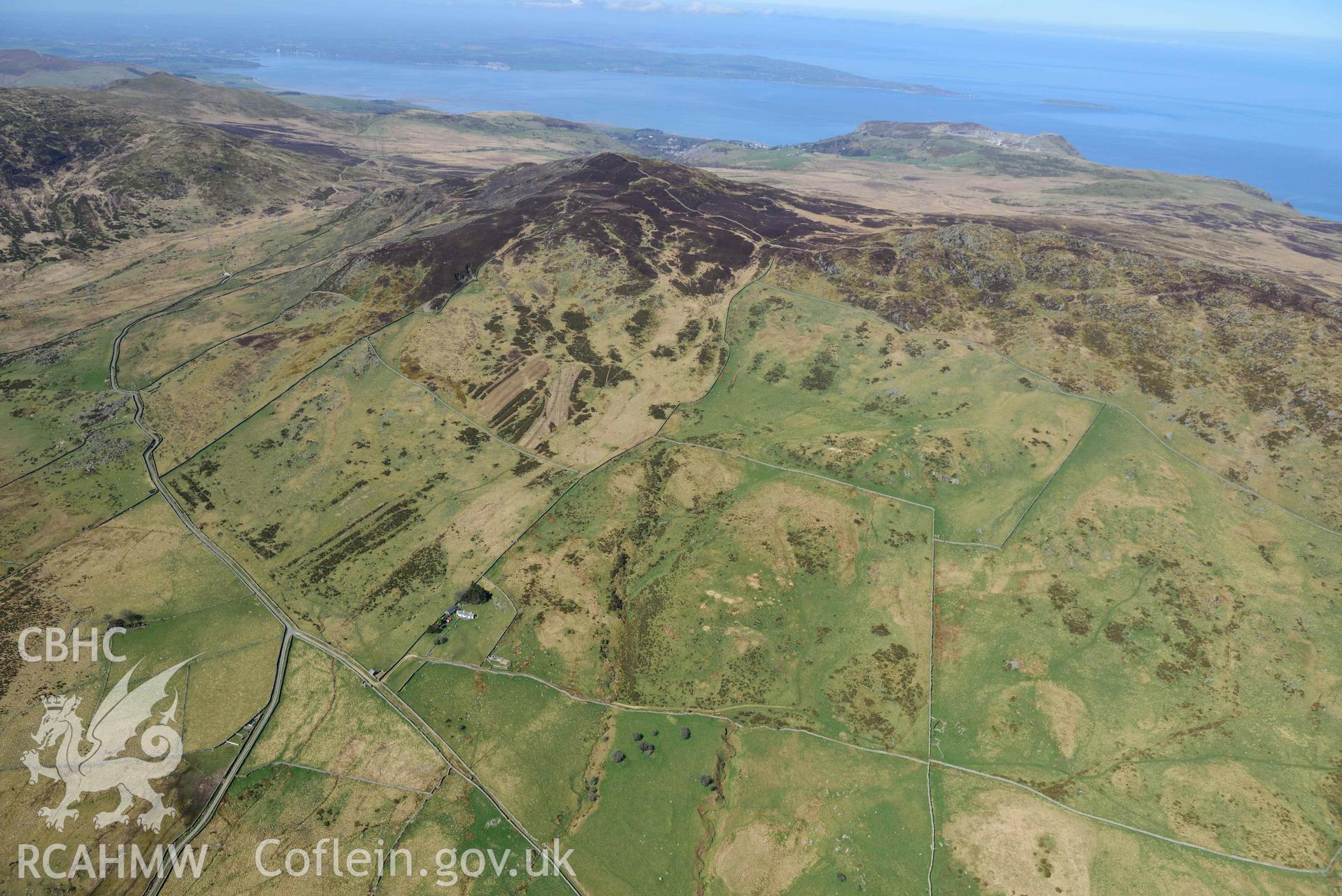 Bwlch y Ddeufaen from Cae Coch, view looking west. Oblique aerial photograph taken during the Royal Commission’s programme of archaeological aerial reconnaissance by Toby Driver on 20 April 2018.