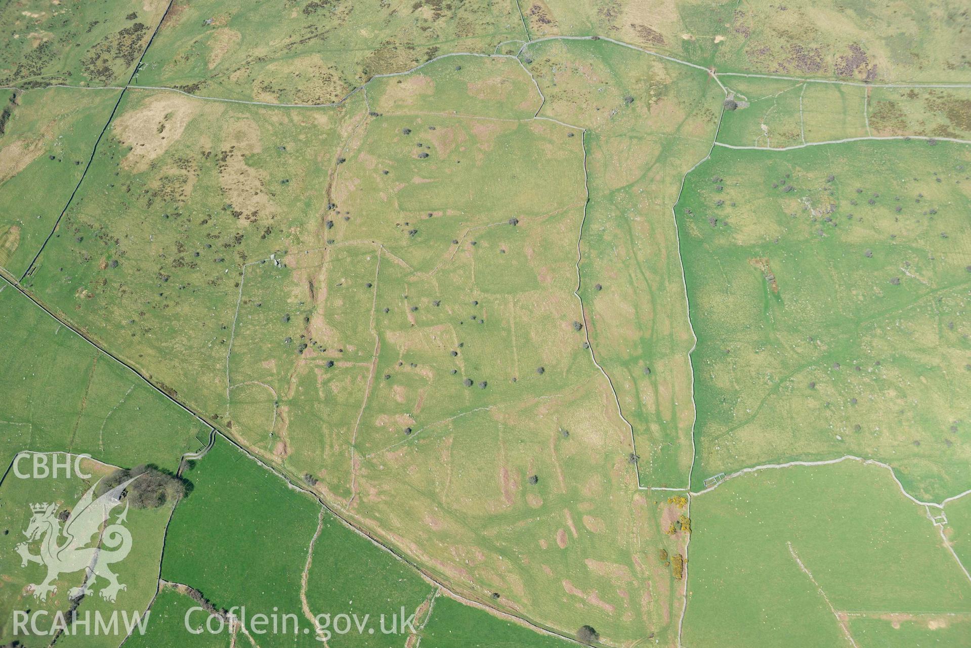 Field system near Maen y Bardd. Oblique aerial photograph taken during the Royal Commission’s programme of archaeological aerial reconnaissance by Toby Driver on 20 April 2018.