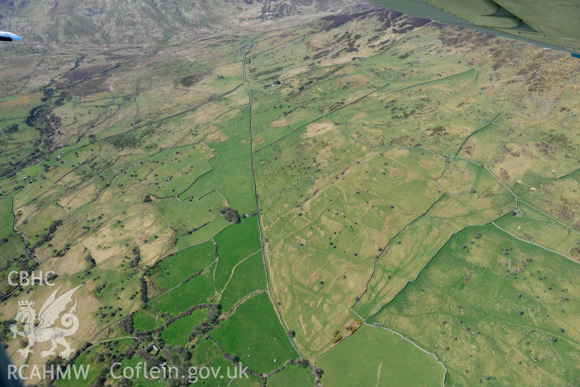 Field system near Maen y Bardd, view from east. Oblique aerial photograph taken during the Royal Commission’s programme of archaeological aerial reconnaissance by Toby Driver on 20 April 2018.