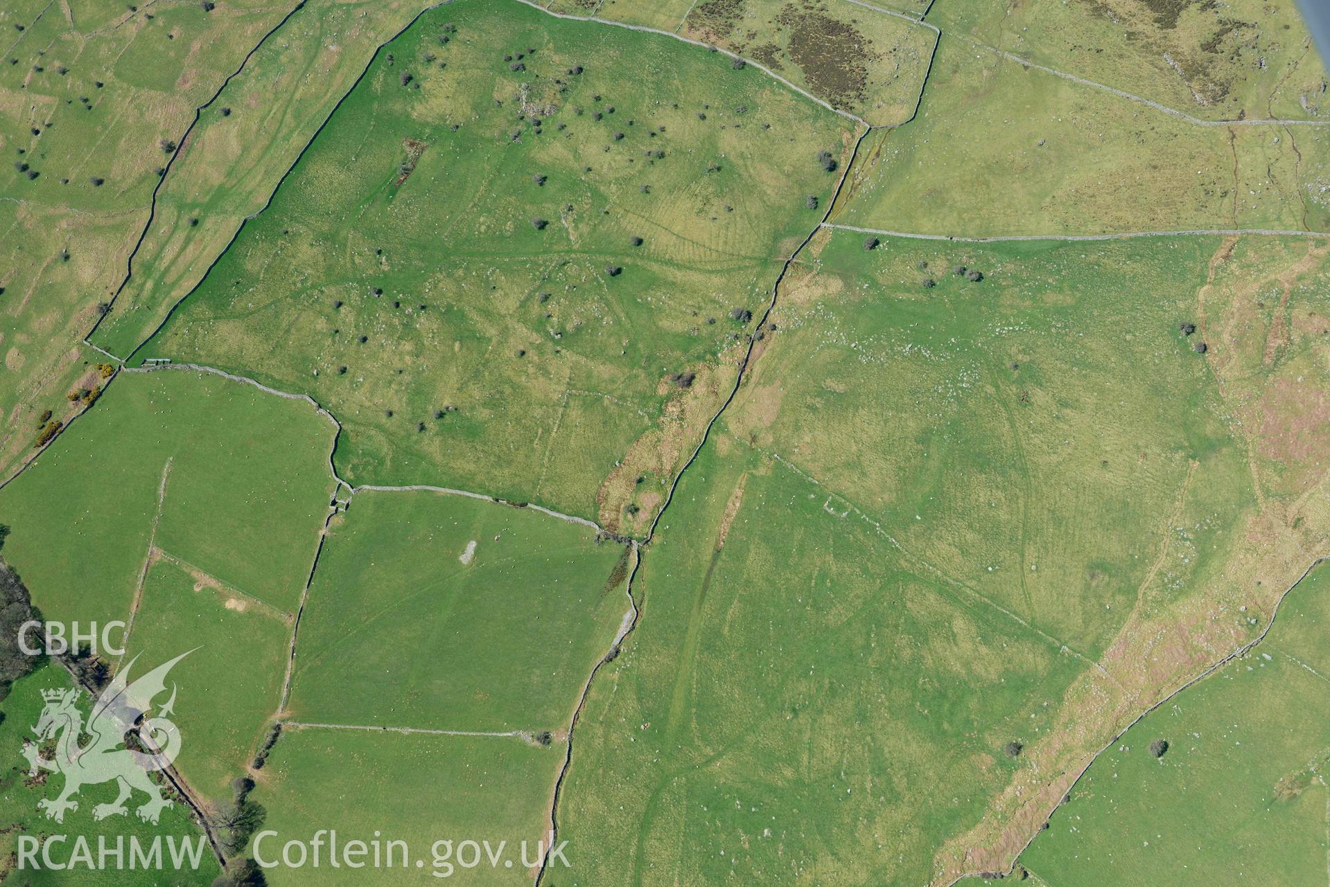 Field system near Maen y Bardd, view from east. Oblique aerial photograph taken during the Royal Commission’s programme of archaeological aerial reconnaissance by Toby Driver on 20 April 2018.