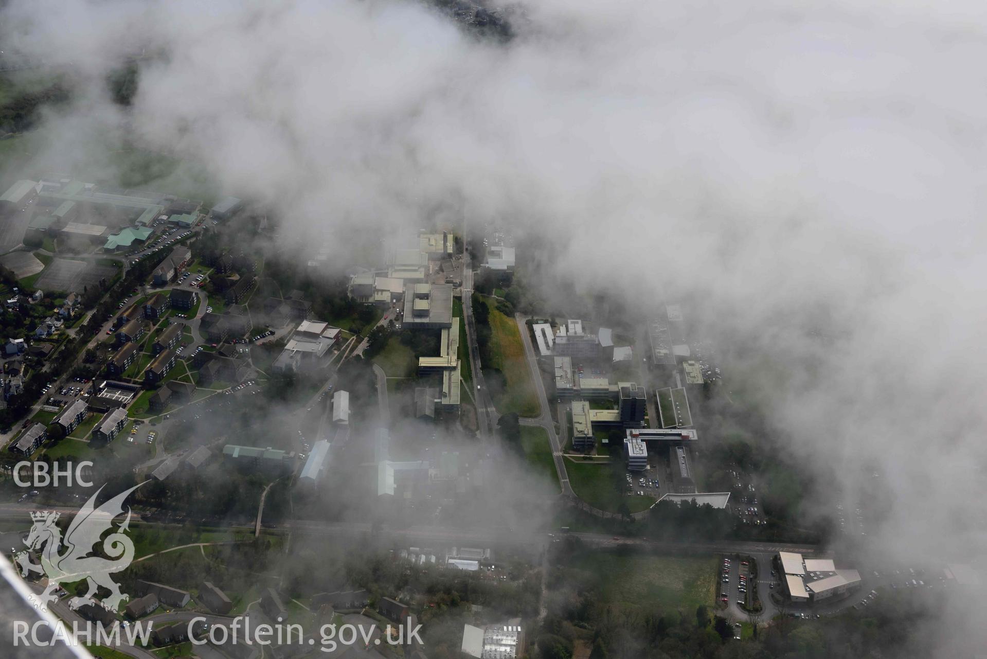 Aberystwyth University, with sea fog. Oblique aerial photograph taken during the Royal Commission’s programme of archaeological aerial reconnaissance by Toby Driver on 20 April 2018.