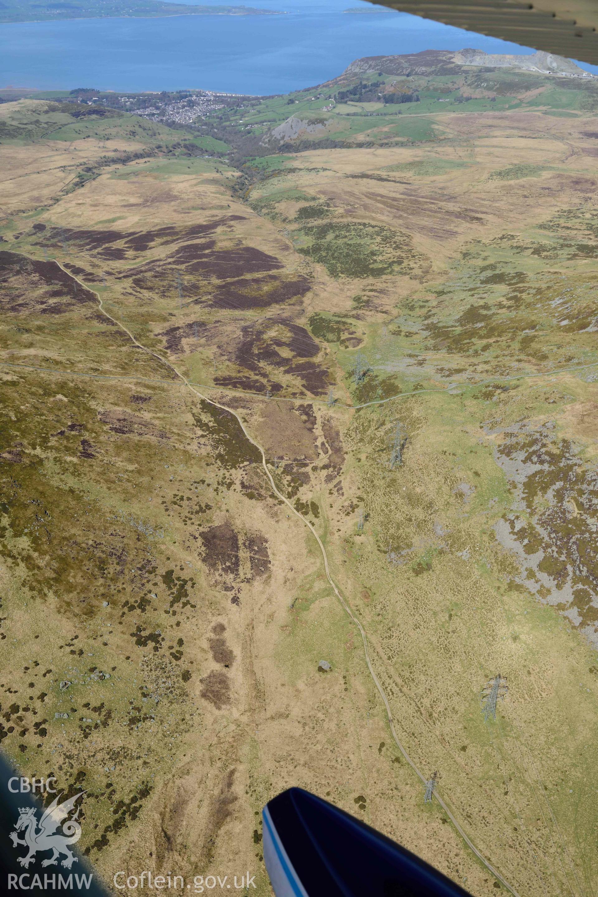 Bwlch-y-Ddeufaen, landscape looking north-west with Roman road. Oblique aerial photograph taken during the Royal Commission’s programme of archaeological aerial reconnaissance by Toby Driver on 20 April 2018.