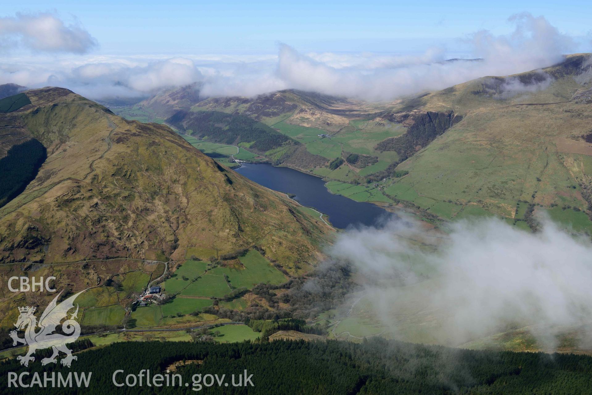 Tal-y-llyn Lake, mountain landscape from east. Oblique aerial photograph taken during the Royal Commission’s programme of archaeological aerial reconnaissance by Toby Driver on 20 April 2018.