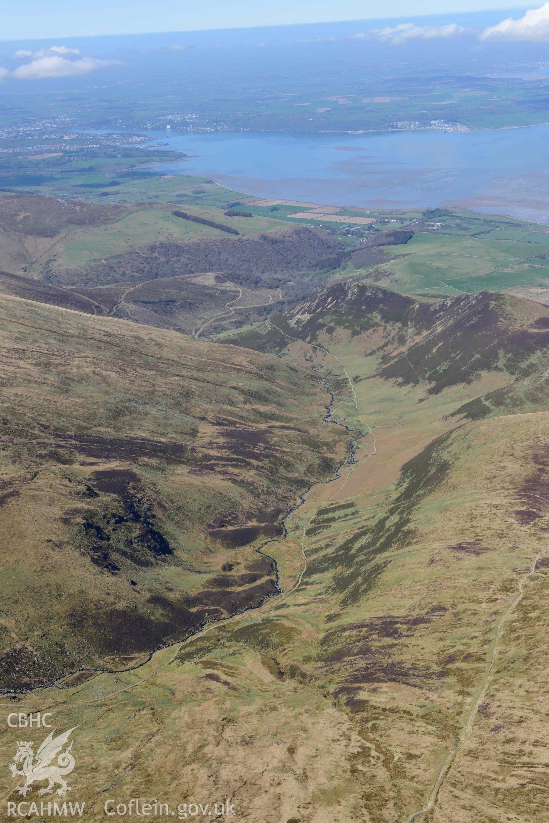 Afon Anafon valley, landscape view looking west. Oblique aerial photograph taken during the Royal Commission’s programme of archaeological aerial reconnaissance by Toby Driver on 20 April 2018.