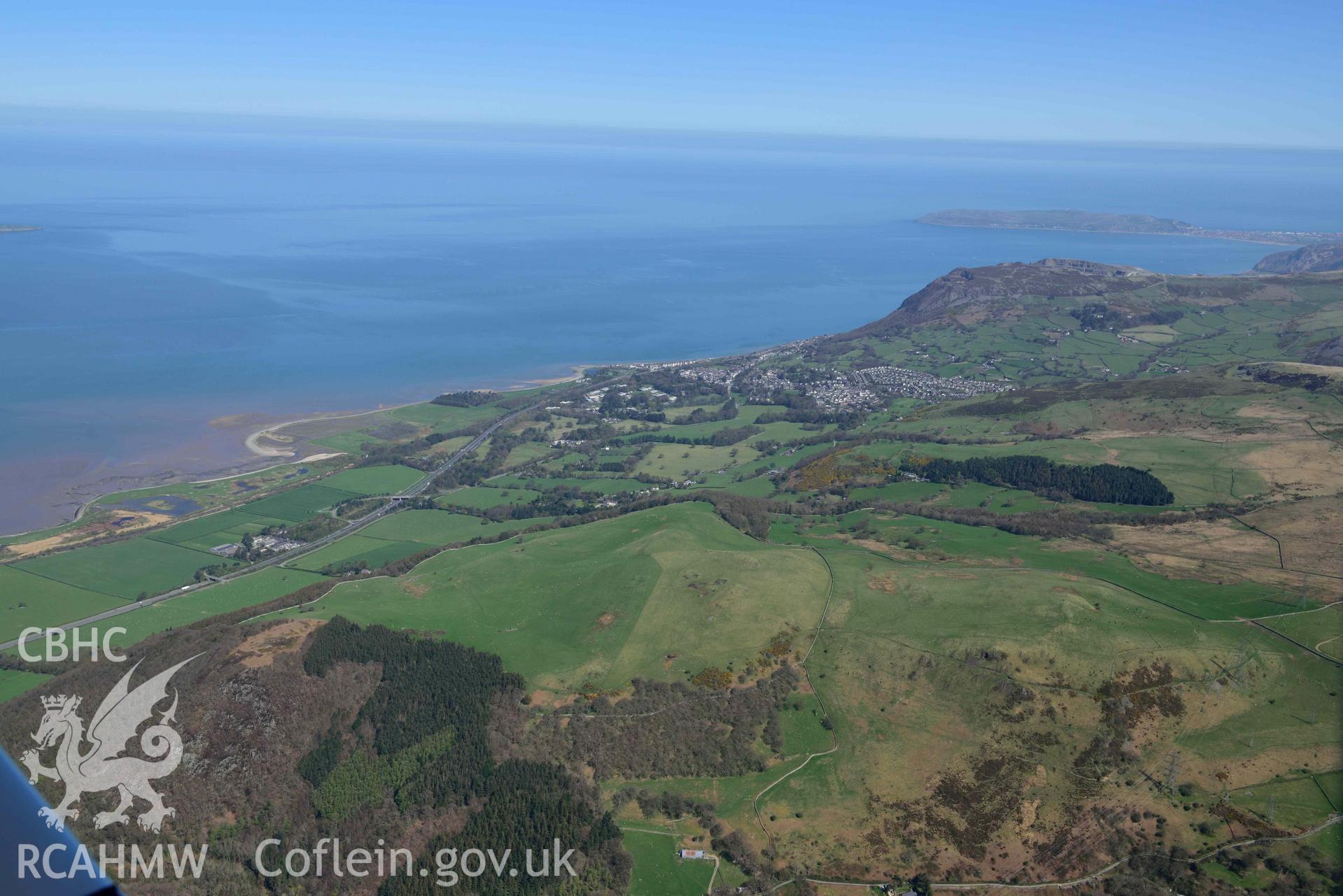 Braich y Dinas hillfort (site of), landscape view from south-west. Oblique aerial photograph taken during the Royal Commission’s programme of archaeological aerial reconnaissance by Toby Driver on 20 April 2018.