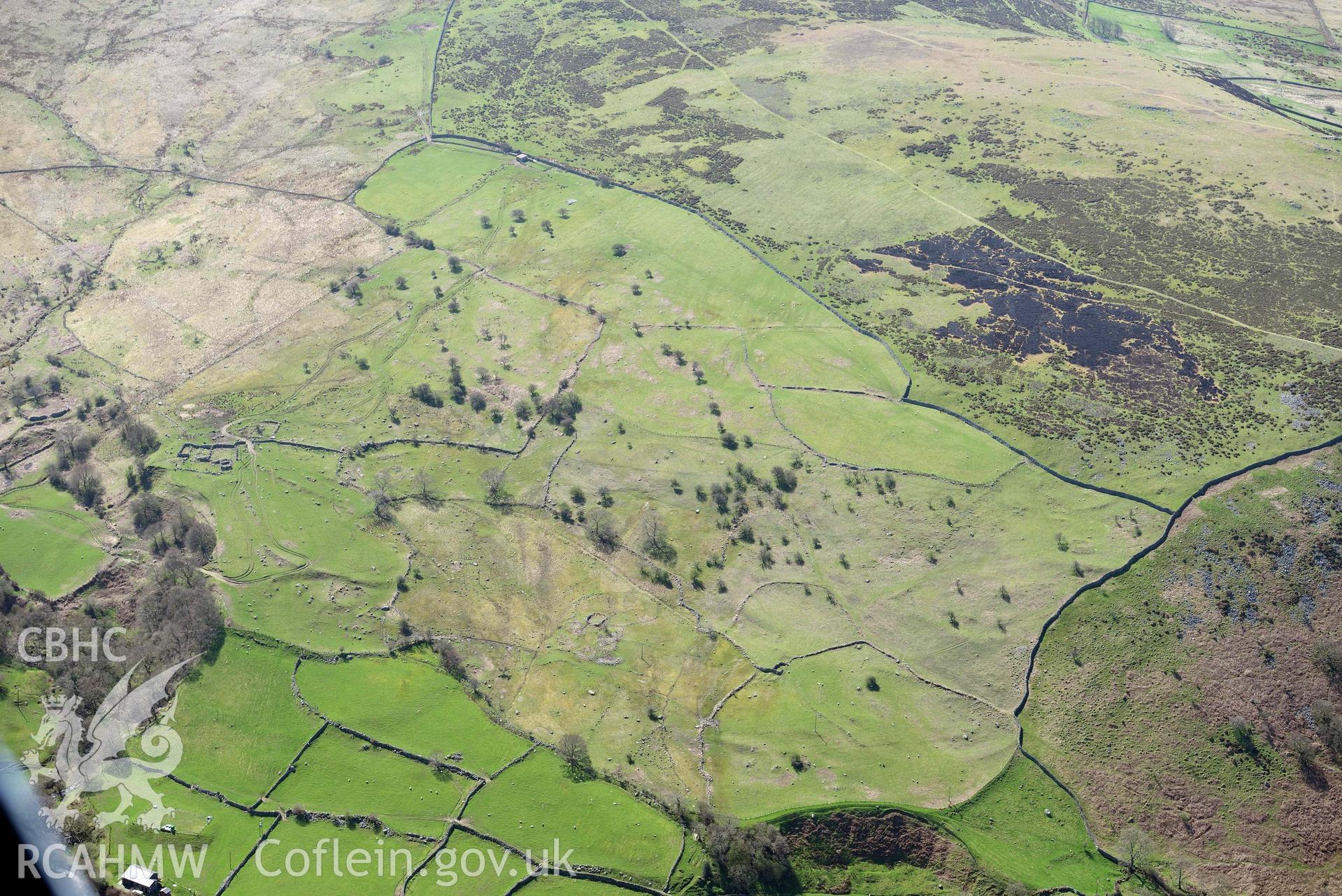 Early field system and settlements at Pont-y-Teiryd, view from north. Oblique aerial photograph taken during the Royal Commission’s programme of archaeological aerial reconnaissance by Toby Driver on 20 April 2018.