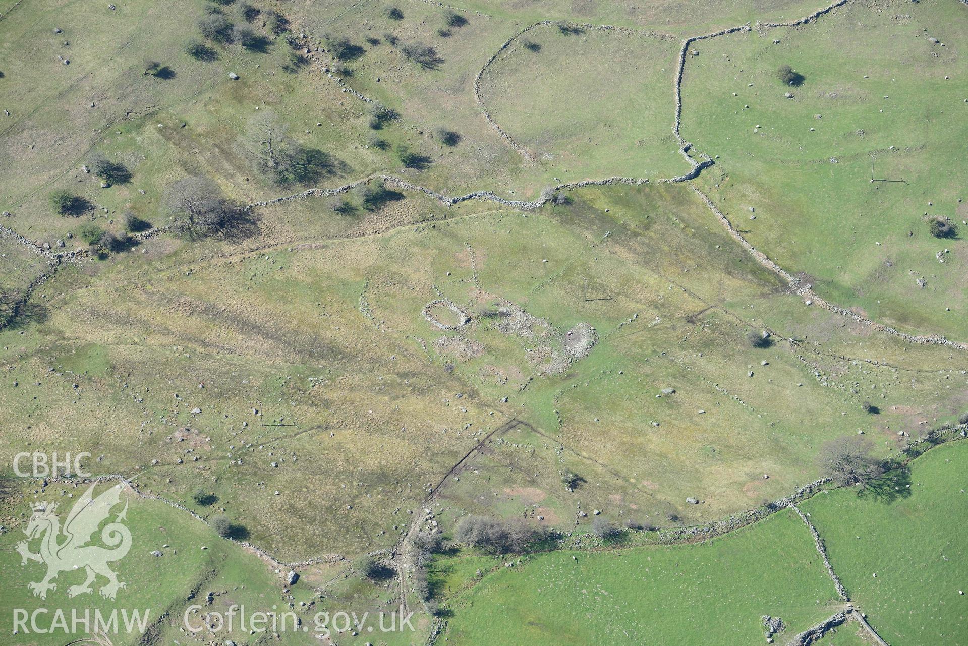 Pont-y-Teiryd, enclosed settlement and hut group, view from north-east. Oblique aerial photograph taken during the Royal Commission’s programme of archaeological aerial reconnaissance by Toby Driver on 20 April 2018.