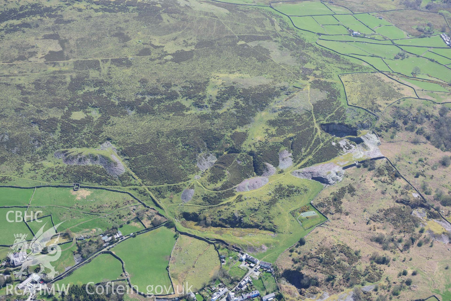 Fortified settlement above Rachub, and Moel Faban slate quarries. Oblique aerial photograph taken during the Royal Commission’s programme of archaeological aerial reconnaissance by Toby Driver on 20 April 2018.