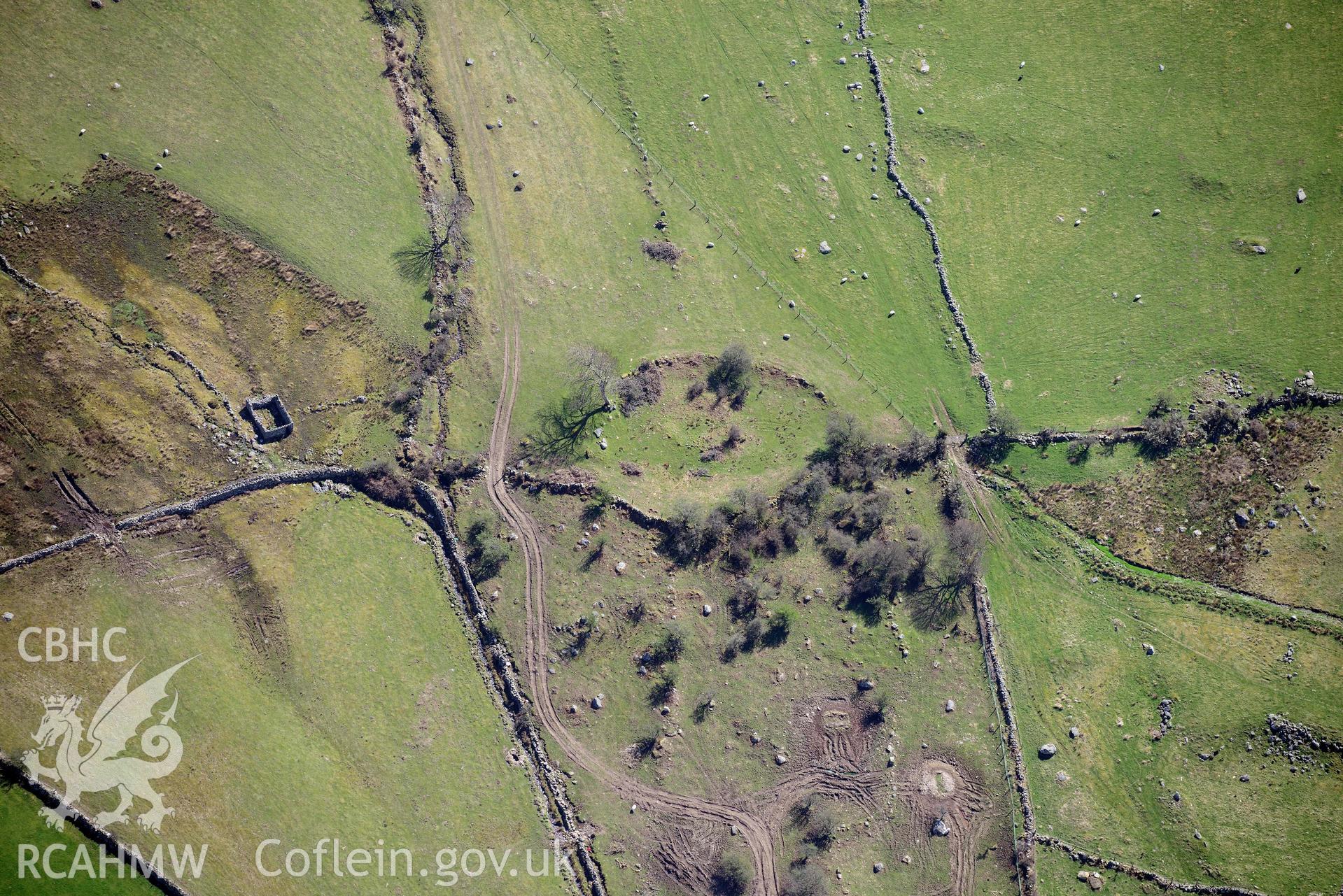 Moel Faban enclosed settlement, view from west. Oblique aerial photograph taken during the Royal Commission’s programme of archaeological aerial reconnaissance by Toby Driver on 20 April 2018.