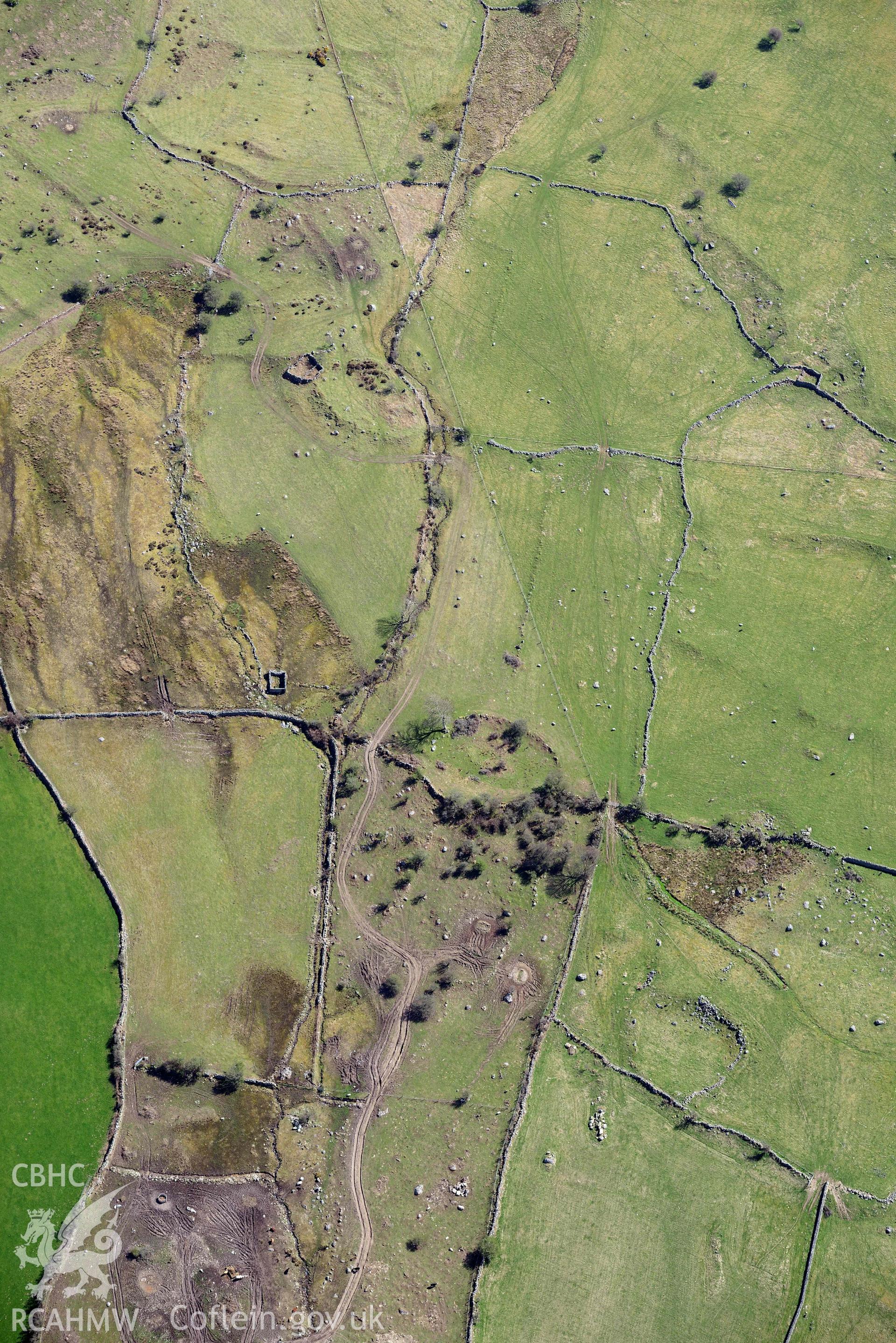 Moel Faban enclosed settlement, view from west. Oblique aerial photograph taken during the Royal Commission’s programme of archaeological aerial reconnaissance by Toby Driver on 20 April 2018.