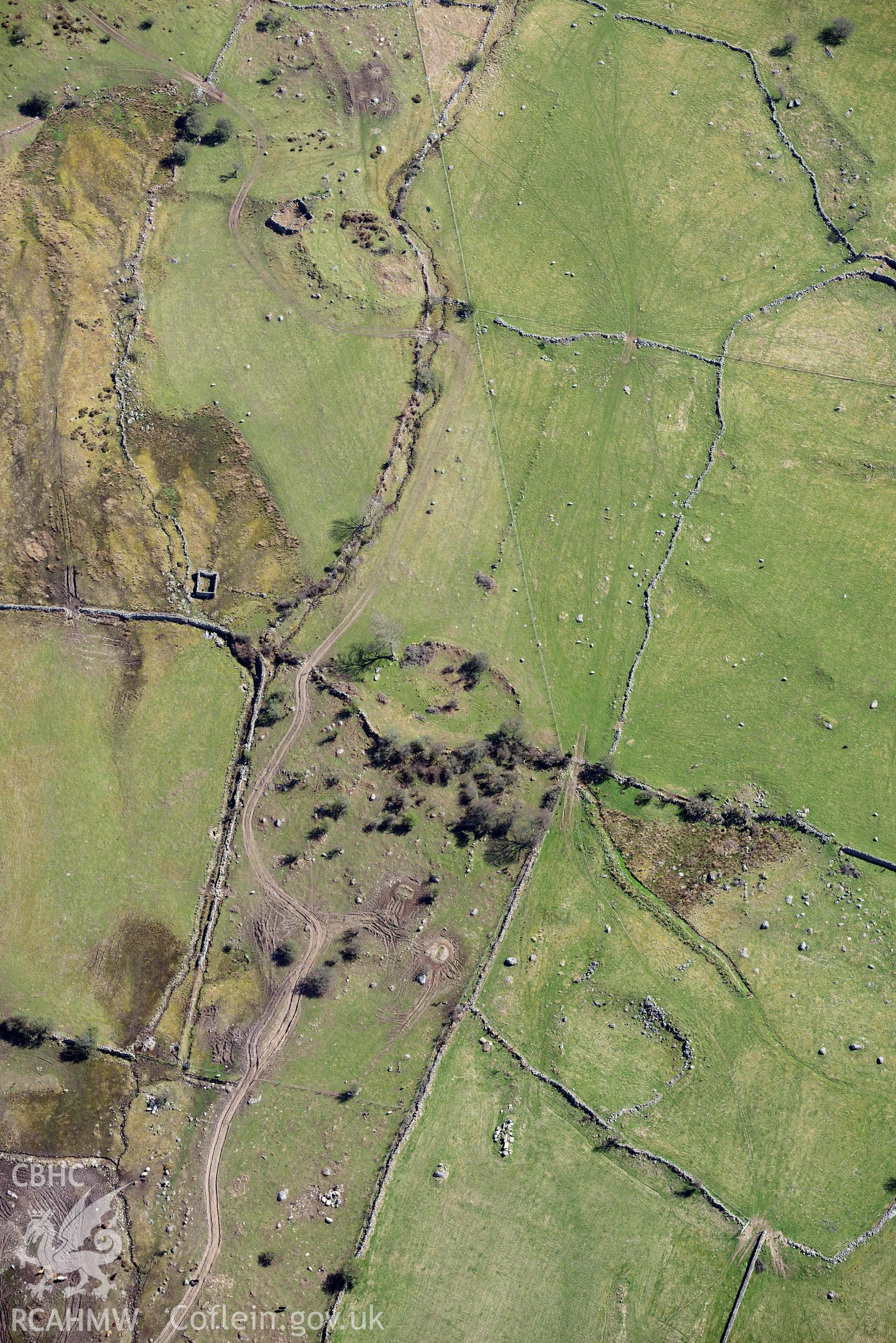 Moel Faban enclosed settlement, view from west. Oblique aerial photograph taken during the Royal Commission’s programme of archaeological aerial reconnaissance by Toby Driver on 20 April 2018.