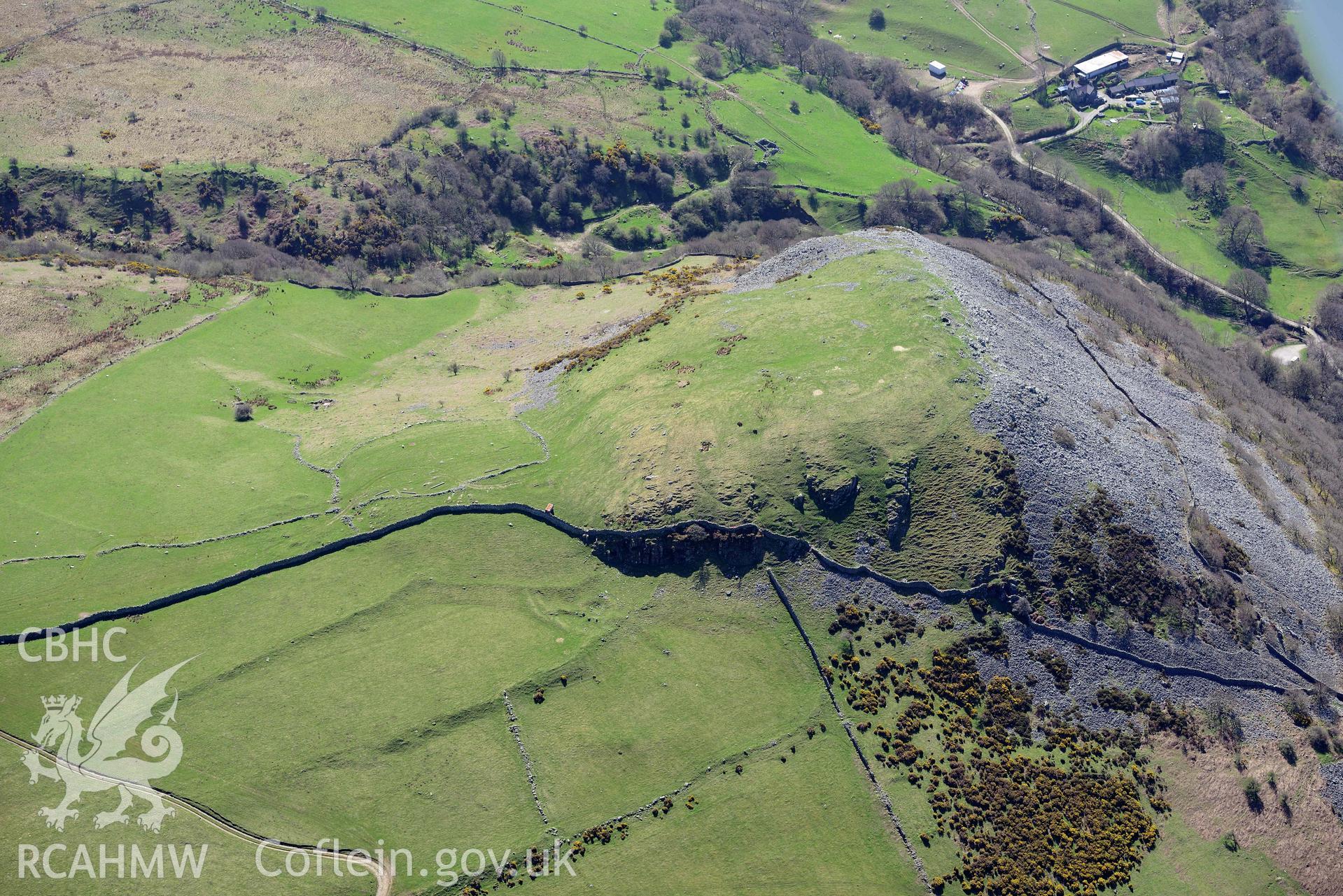 Dinas hillfort, Llanfairfechan, view from north-east. Oblique aerial photograph taken during the Royal Commission’s programme of archaeological aerial reconnaissance by Toby Driver on 20 April 2018.