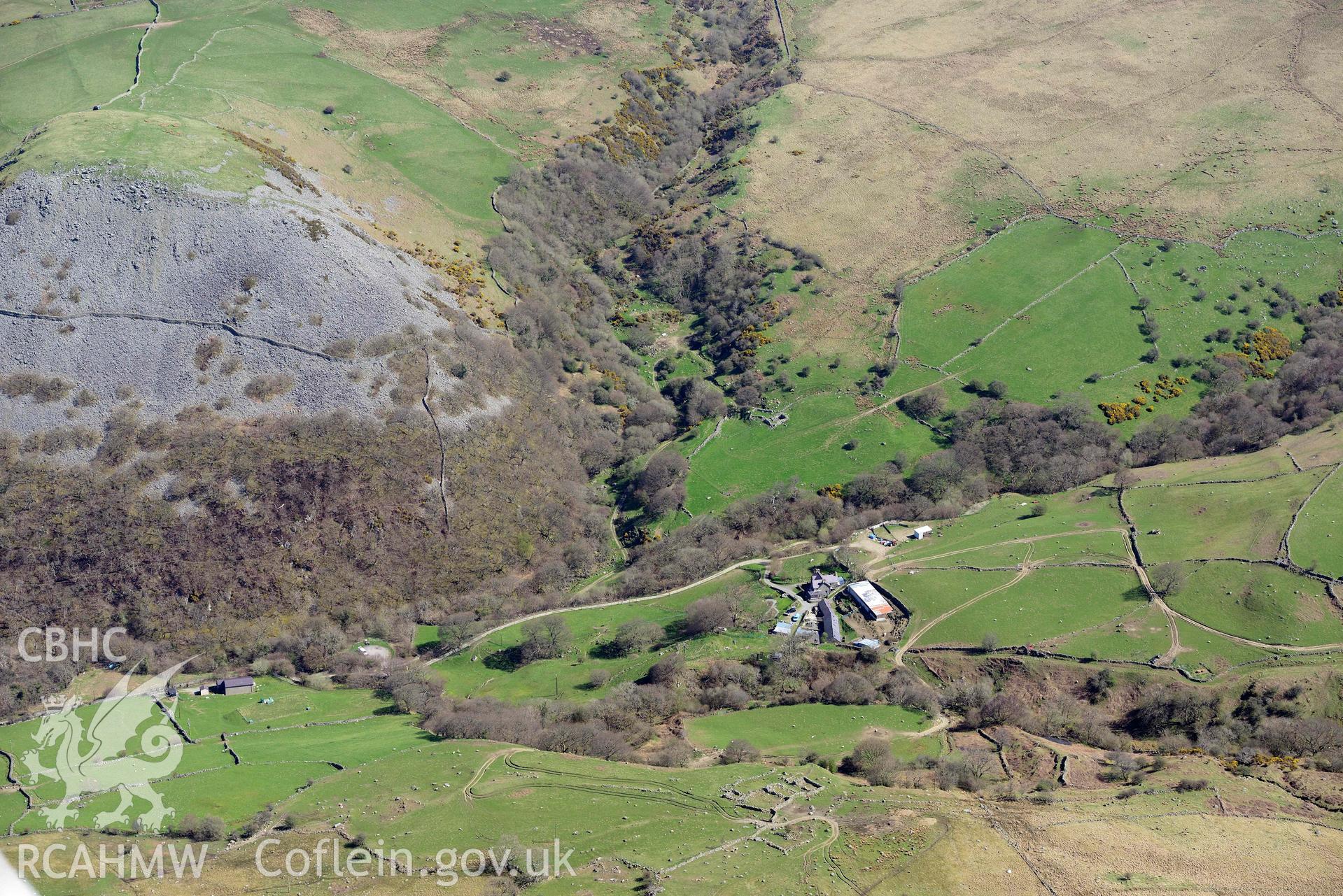 Dinas hillfort, Llanfairfechan, view from south over Cammarnaint. Oblique aerial photograph taken during the Royal Commission’s programme of archaeological aerial reconnaissance by Toby Driver on 20 April 2018.