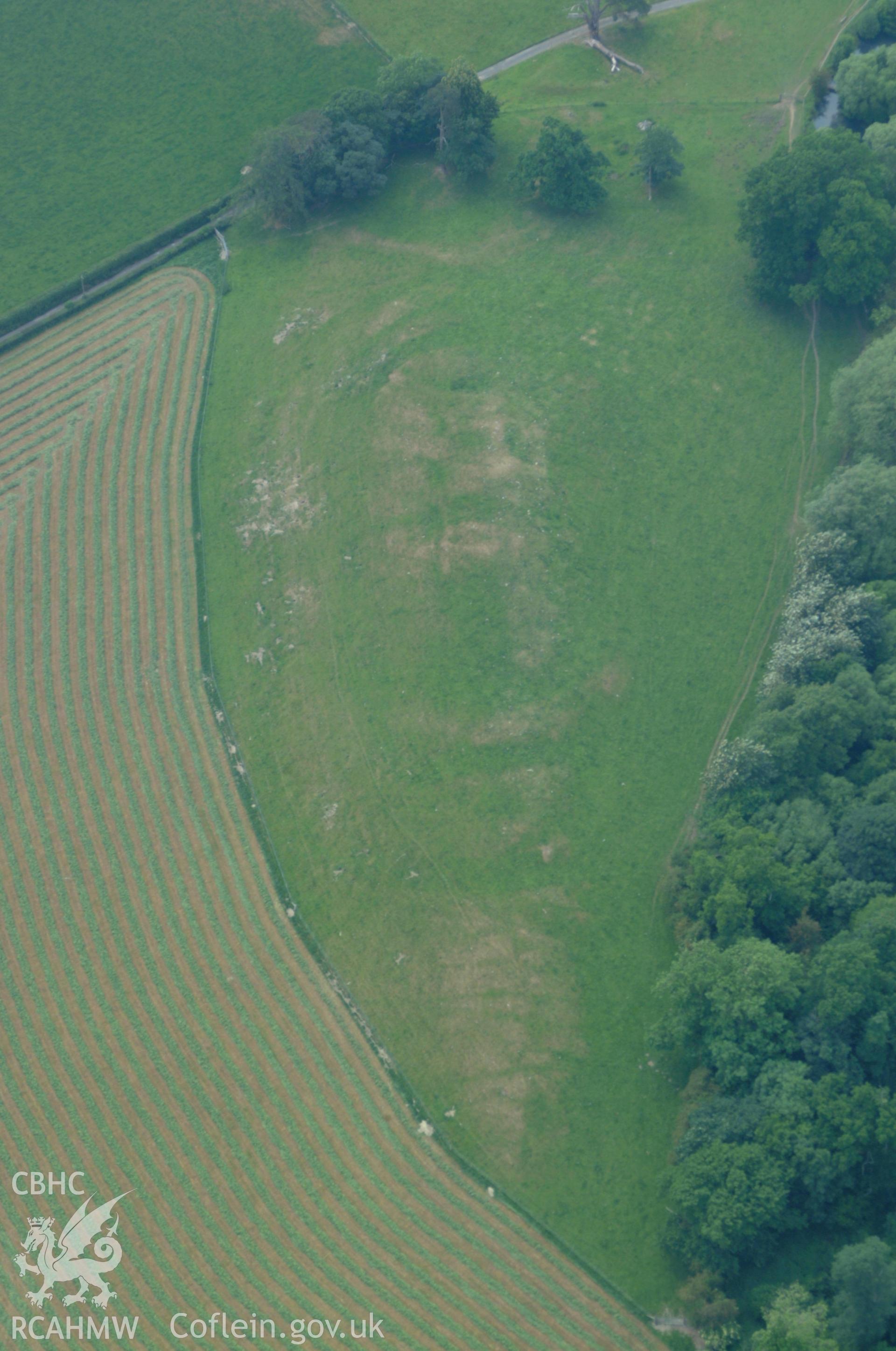 RCAHMW colour oblique aerial photograph of Plas Uchaf Enclosure taken on 08/06/2004 by Toby Driver