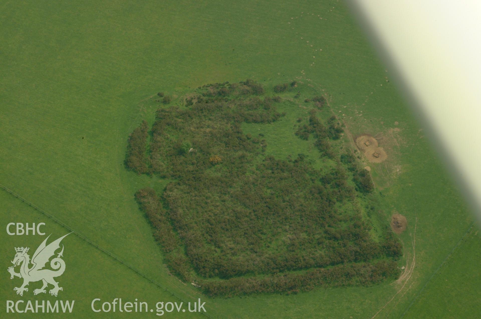 RCAHMW colour oblique aerial photograph of Little Mountain Enclosure taken on 26/05/2004 by Toby Driver