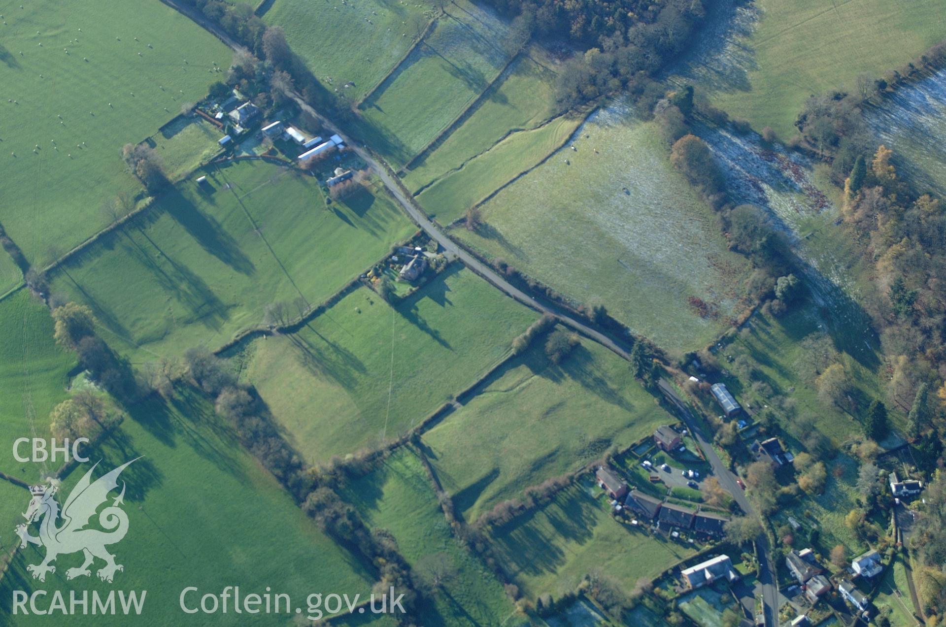 RCAHMW colour oblique aerial photograph of medieval settlement known as Kerry Gate Suburb Earthworks, Montgomery, viewed from the north-east. Taken on 19 November 2004 by Toby Driver