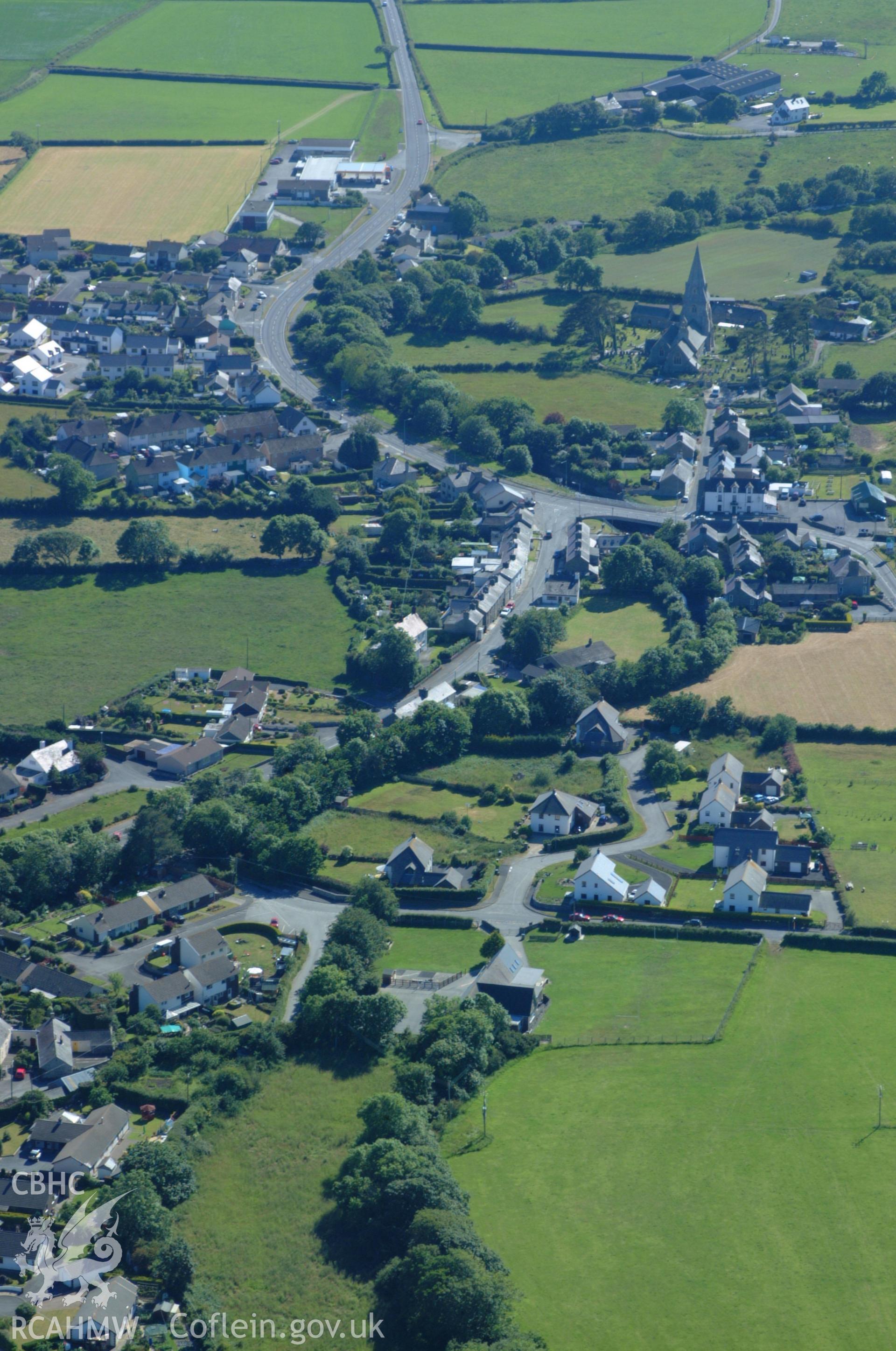 RCAHMW colour oblique aerial photograph of St Rhystud's Church, Llanrhystud taken on 14/06/2004 by Toby Driver