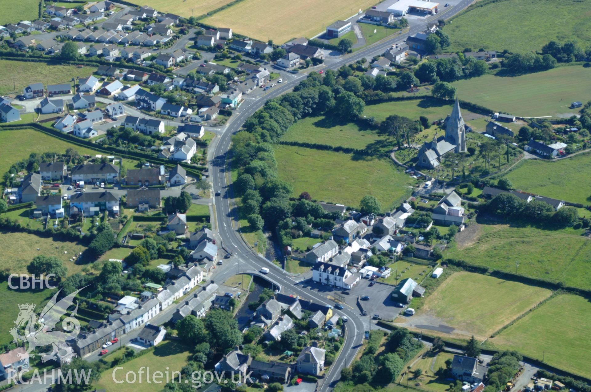 RCAHMW colour oblique aerial photograph of St Rhystud's Church, Llanrhystud taken on 14/06/2004 by Toby Driver