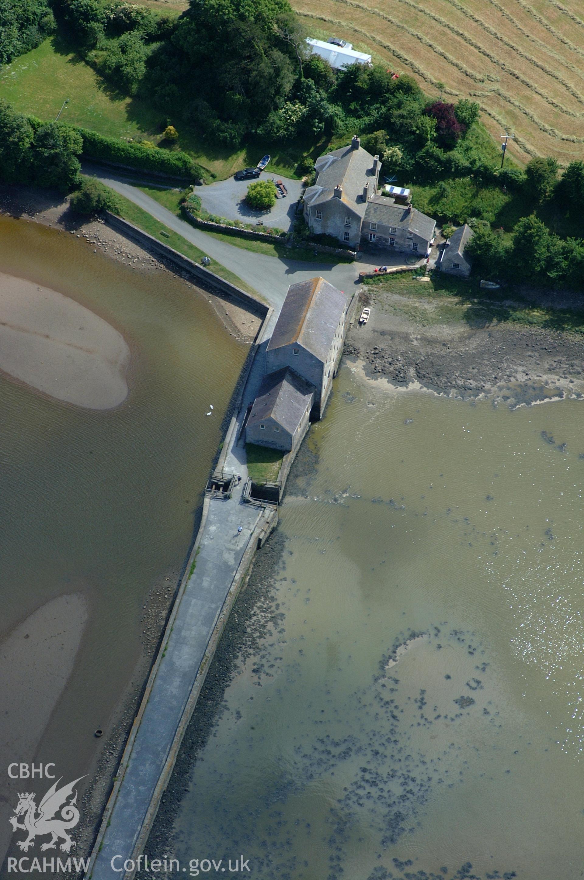 RCAHMW colour oblique aerial photograph of Carew Tide Mill taken on 15/06/2004 by Toby Driver