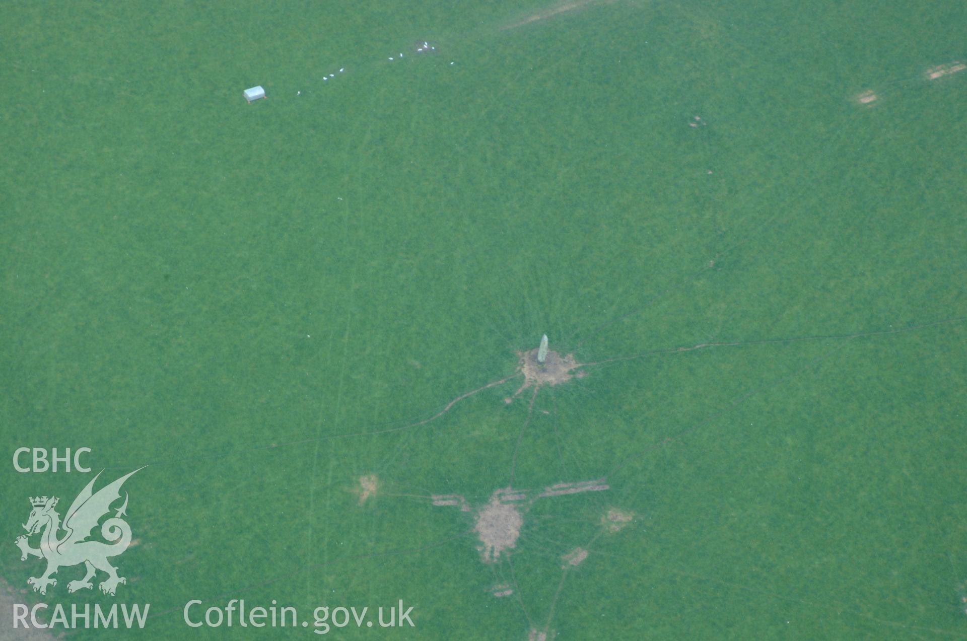 RCAHMW colour oblique aerial photograph of a standing stone southeast of Bodewryd. Taken on 26 May 2004 by Toby Driver