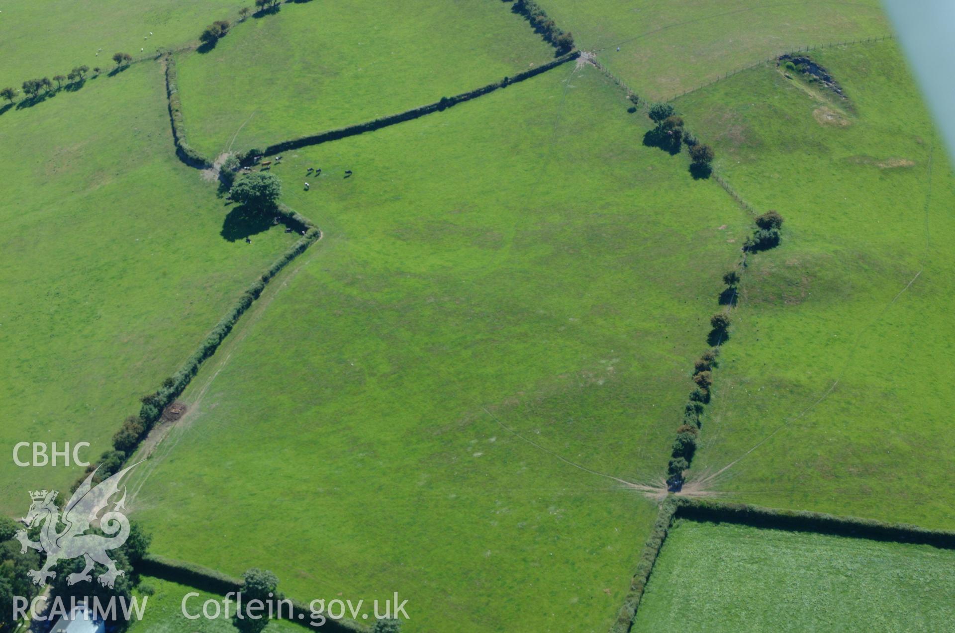 RCAHMW colour oblique aerial photograph showing site of Pen-Llwyn Roman Fort. Taken on 14 June 2004 by Toby Driver