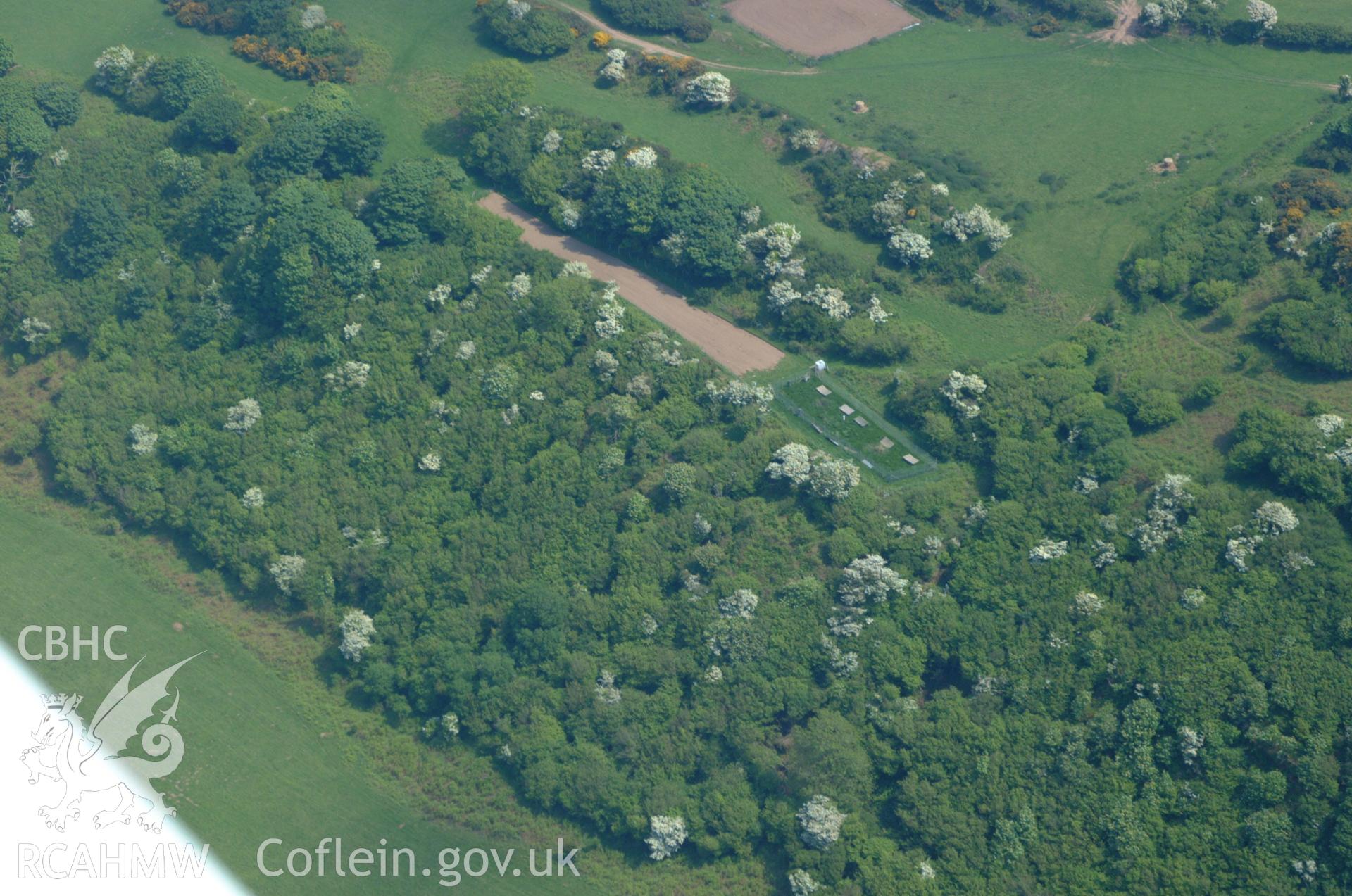 RCAHMW colour oblique aerial photograph of Ogof Arian Cave, in general view. Taken on 26 May 2004 by Toby Driver