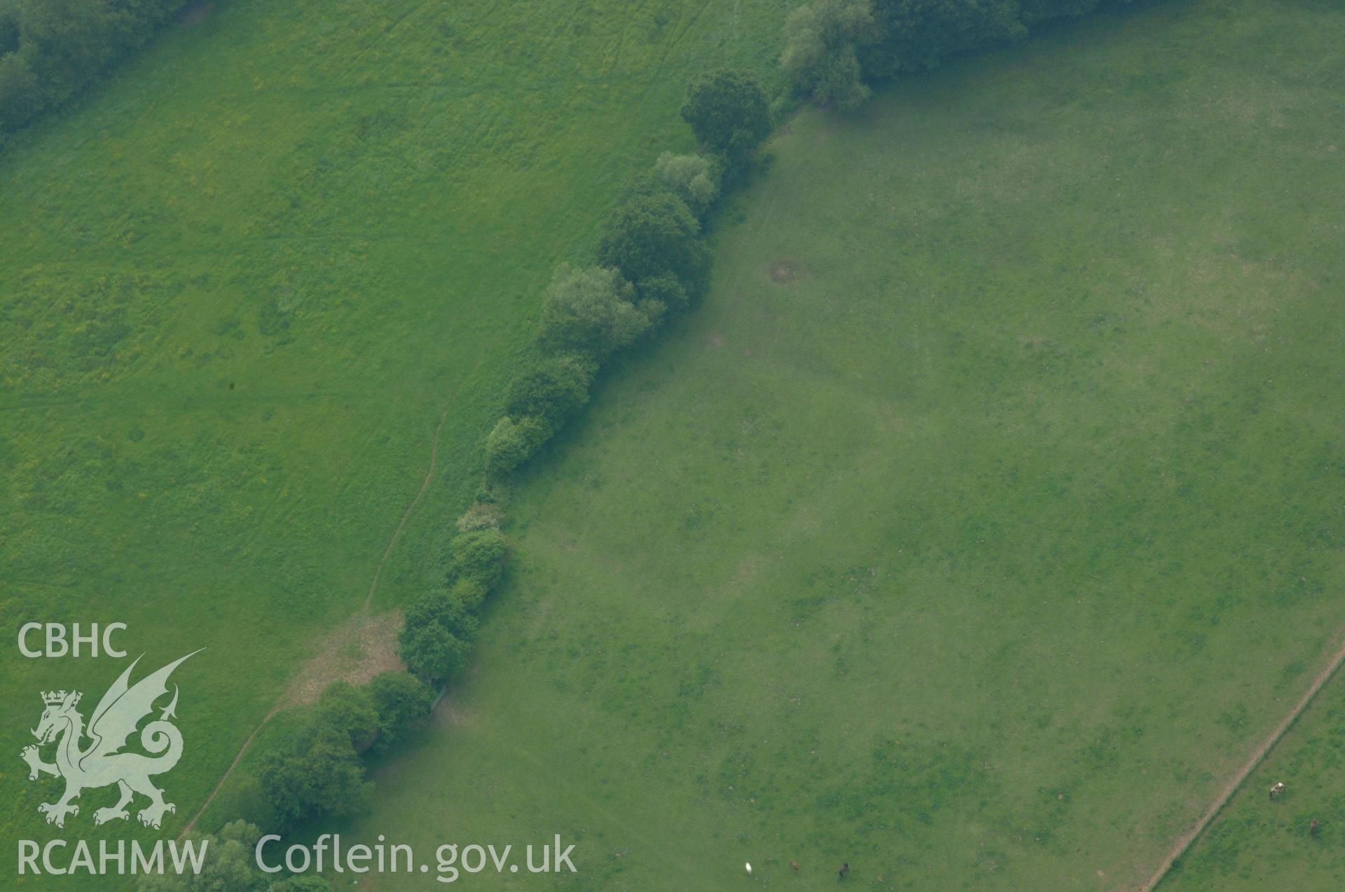 RCAHMW colour oblique aerial photograph of Court Farm Moat. Taken on 26 May 2004 by Toby Driver