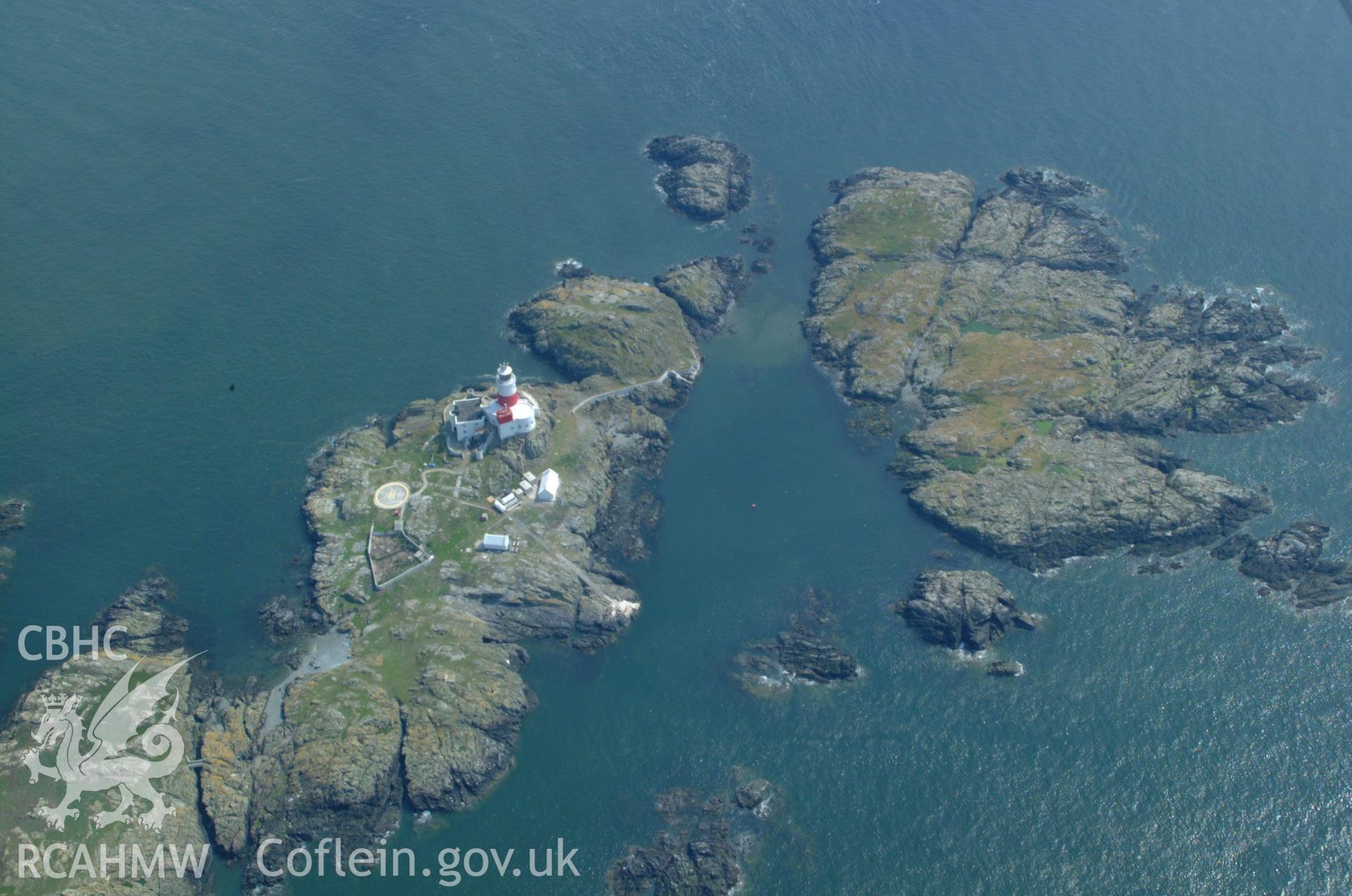 RCAHMW colour oblique aerial photograph of the Skerries Lighthouse taken on 26/05/2004 by Toby Driver