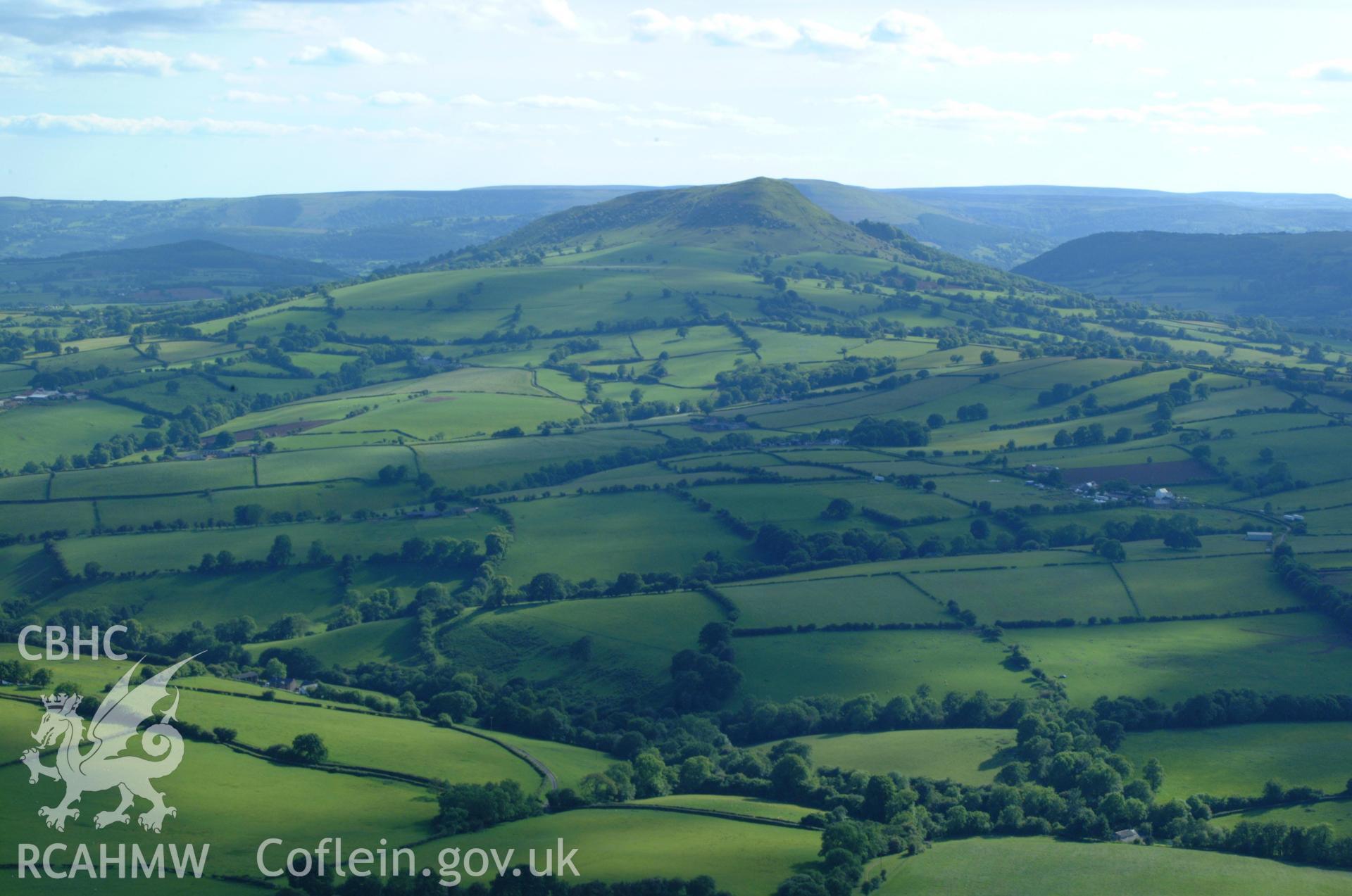 RCAHMW colour oblique aerial photograph of Ysgyryd Fawr (The Skirrid). Taken on 02 June 2004 by Toby Driver