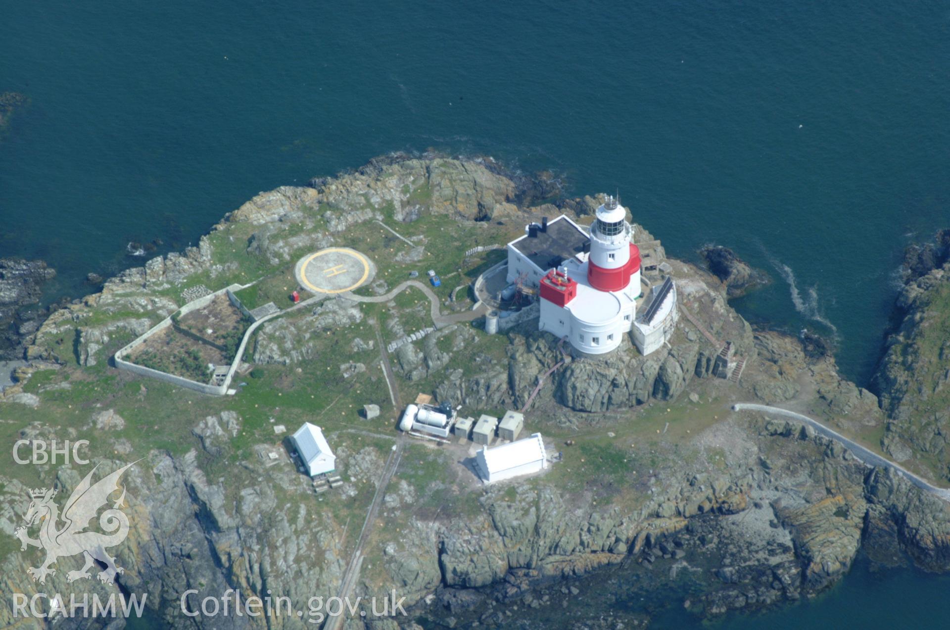 RCAHMW colour oblique aerial photograph of the Skerries Lighthouse taken on 26/05/2004 by Toby Driver