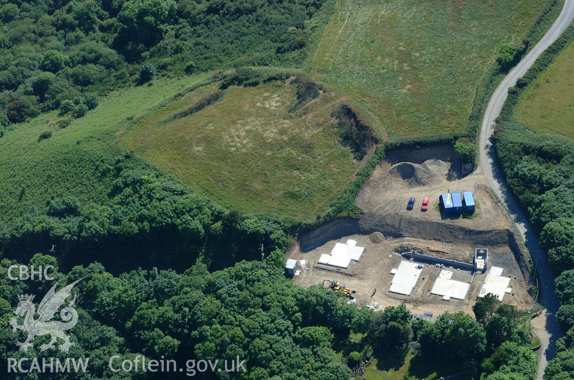 RCAHMW colour oblique aerial photograph of Woodlands Rath, (Strawberry Hill Enclosure). Taken on 15 June 2004 by Toby Driver