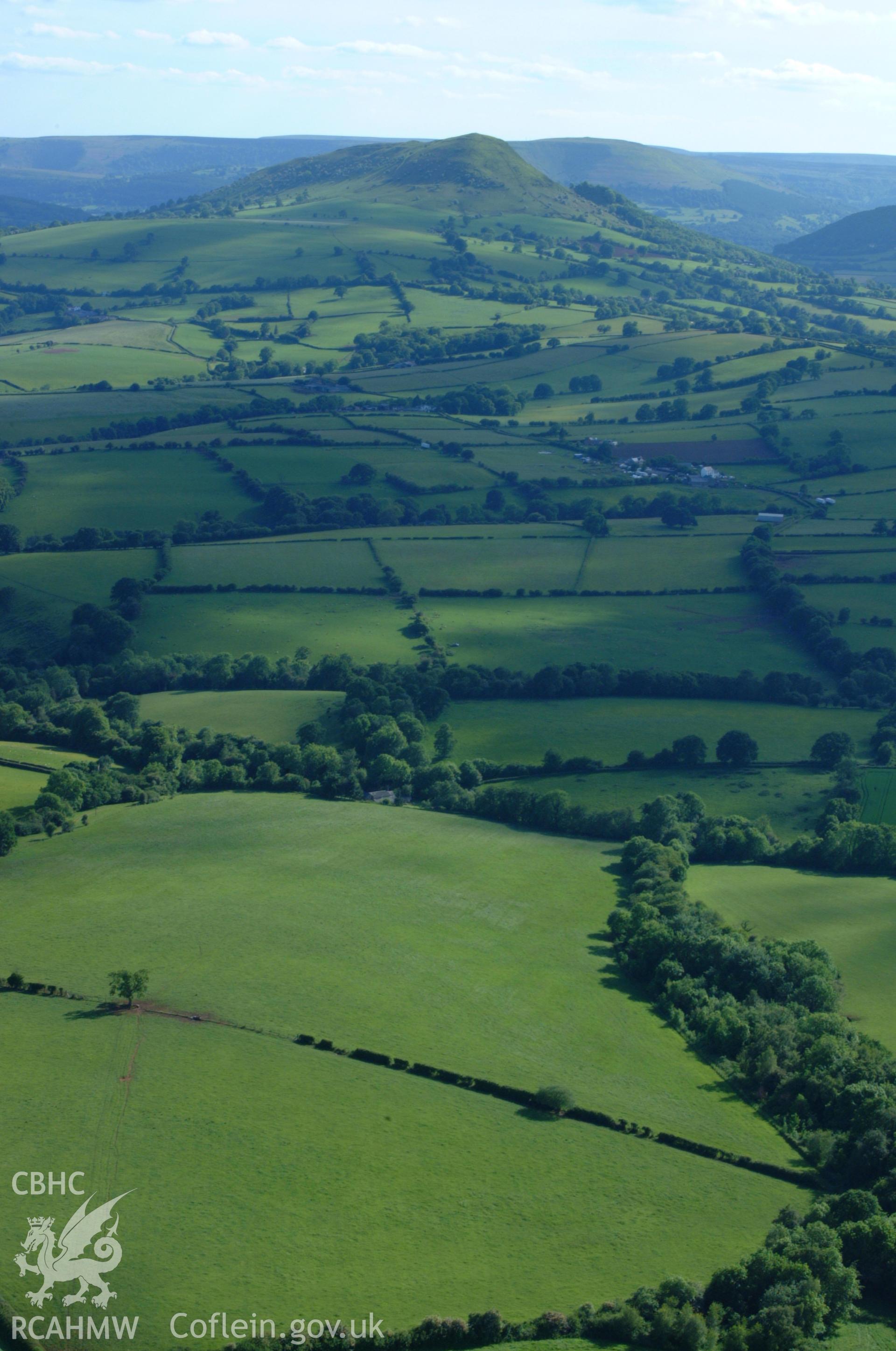 RCAHMW colour oblique aerial photograph of Ysgyryd Fawr (The Skirrid). Taken on 02 June 2004 by Toby Driver