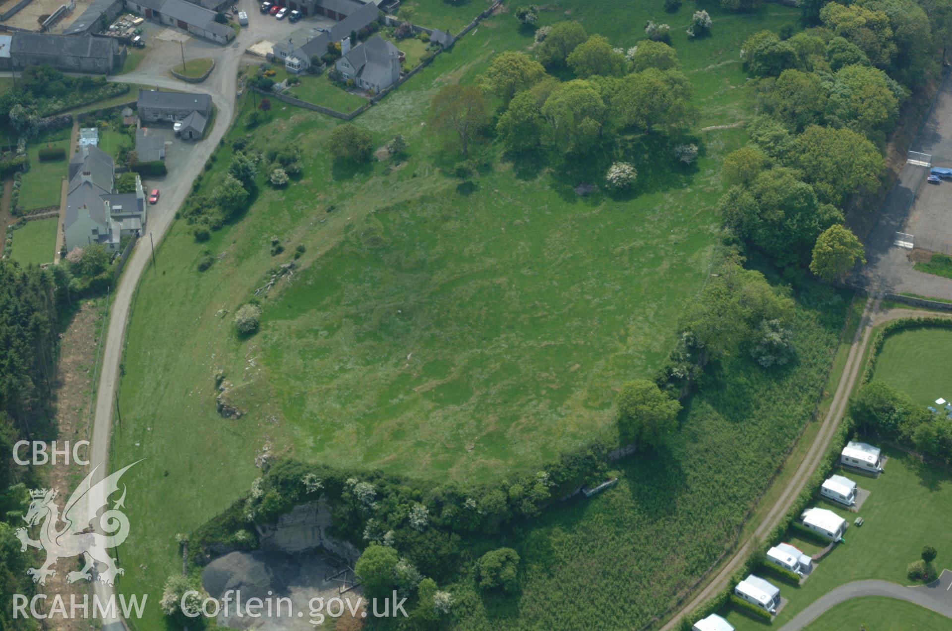 RCAHMW colour oblique aerial photograph of Parciau Hillfort taken on 26/05/2004 by Toby Driver