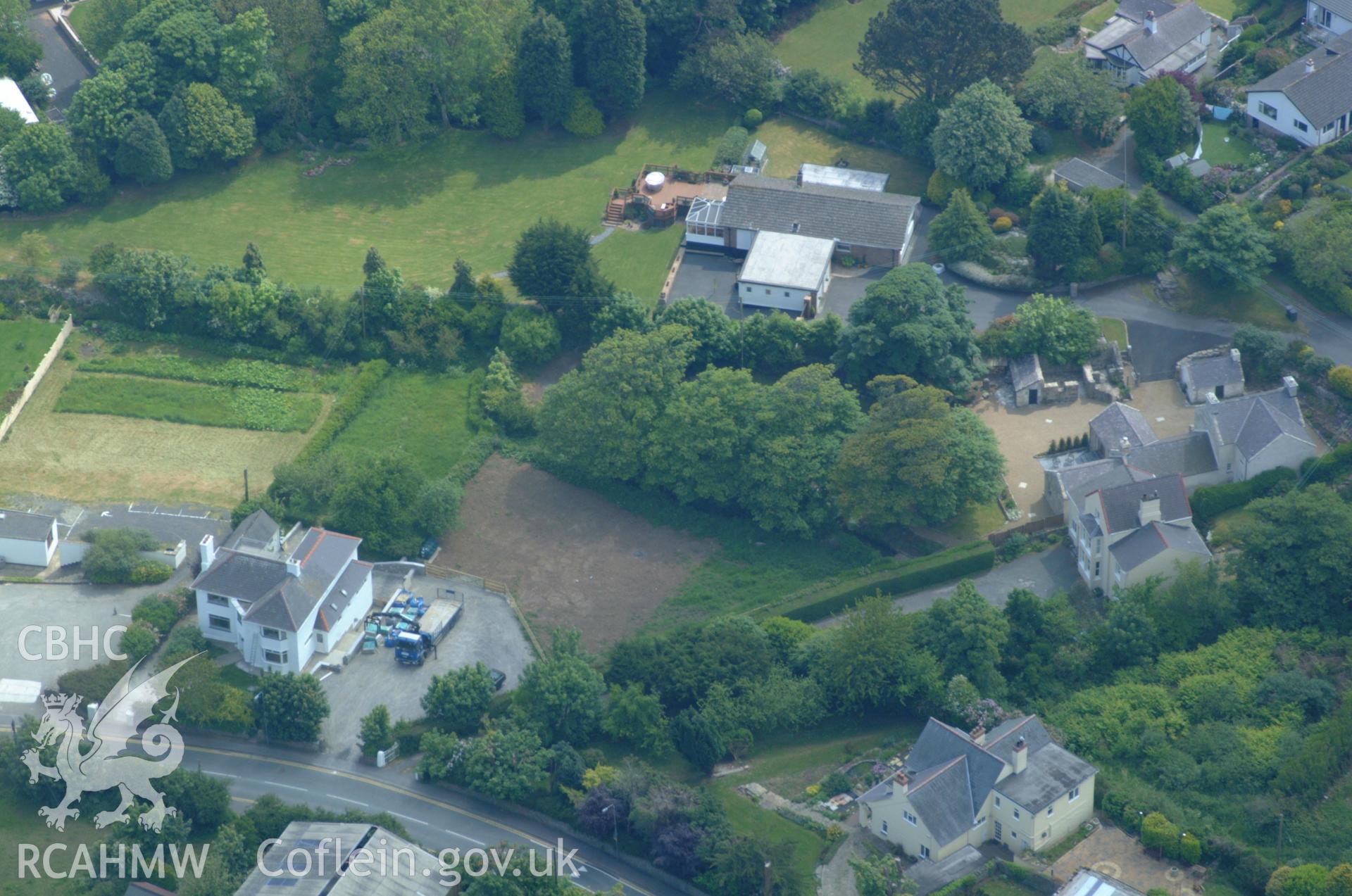 RCAHMW colour oblique aerial photograph of Benllech Burial Chamber taken on 26/05/2004 by Toby Driver