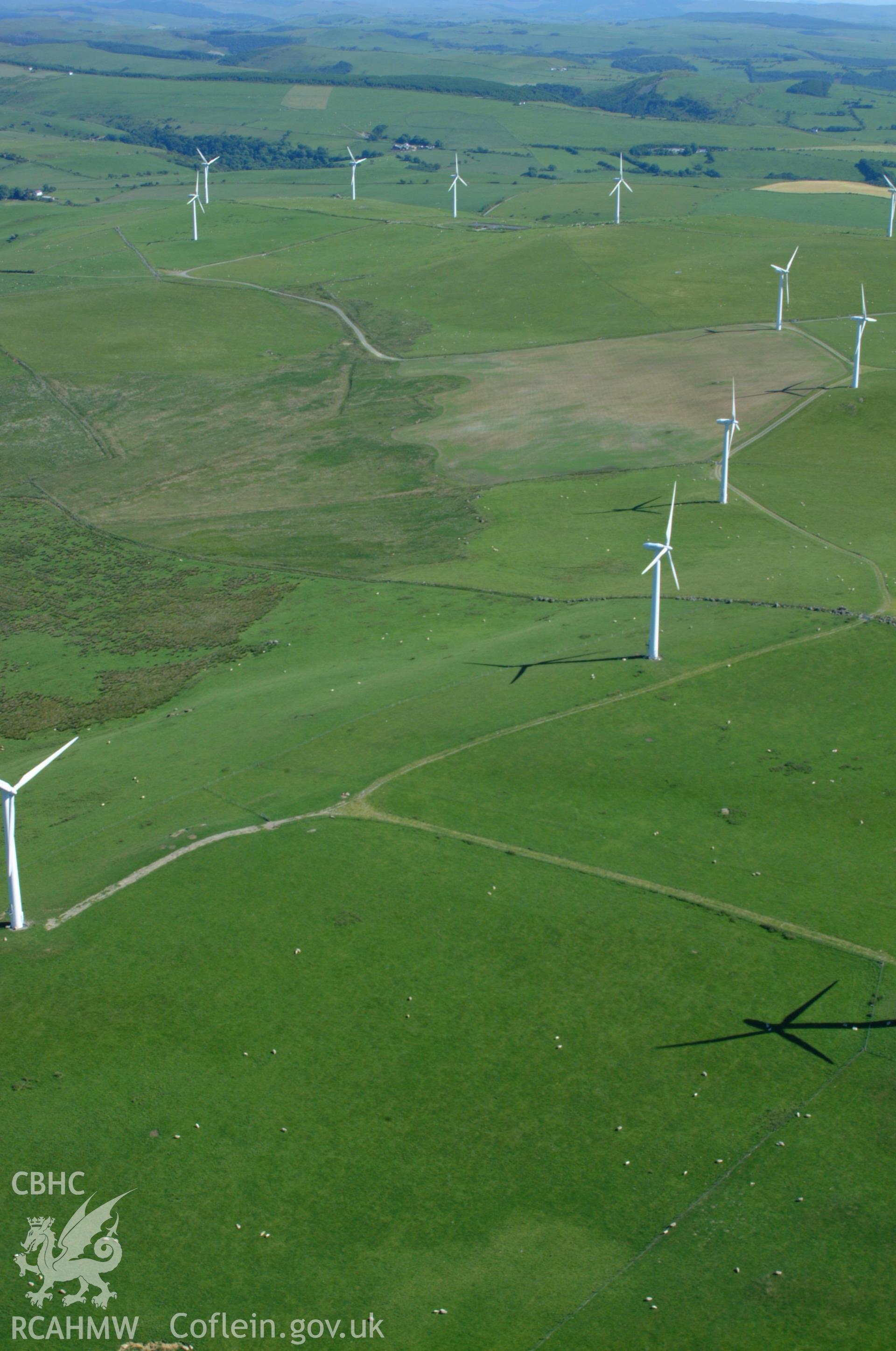 RCAHMW colour oblique aerial photograph of Mynydd Gorddu Wind Farm, Tal-y-bont taken on 14/06/2004 by Toby Driver