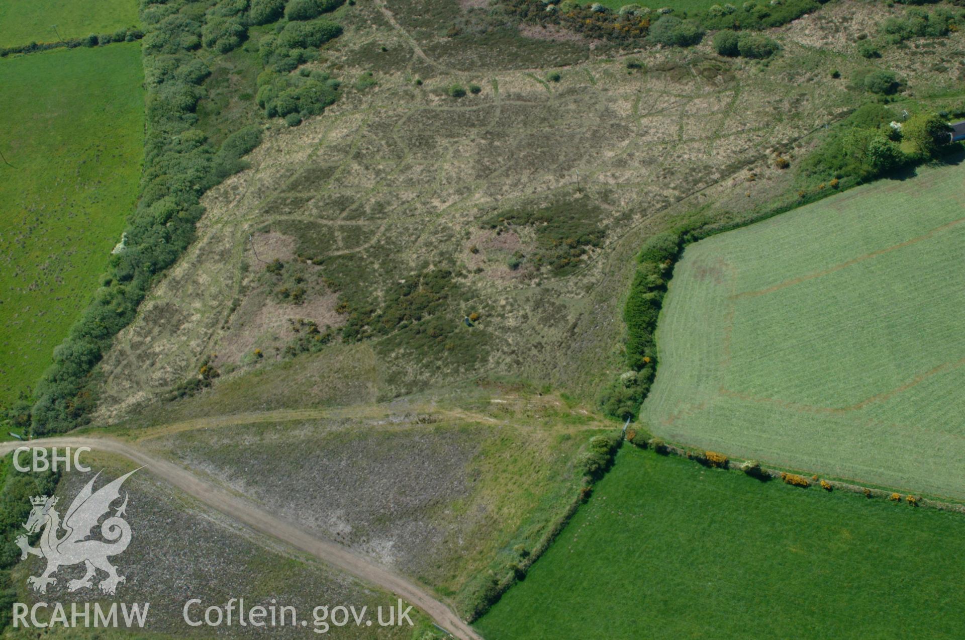 RCAHMW colour oblique aerial photograph of Rhos-y-clegyrn Ring Barrow taken on 25/05/2004 by Toby Driver