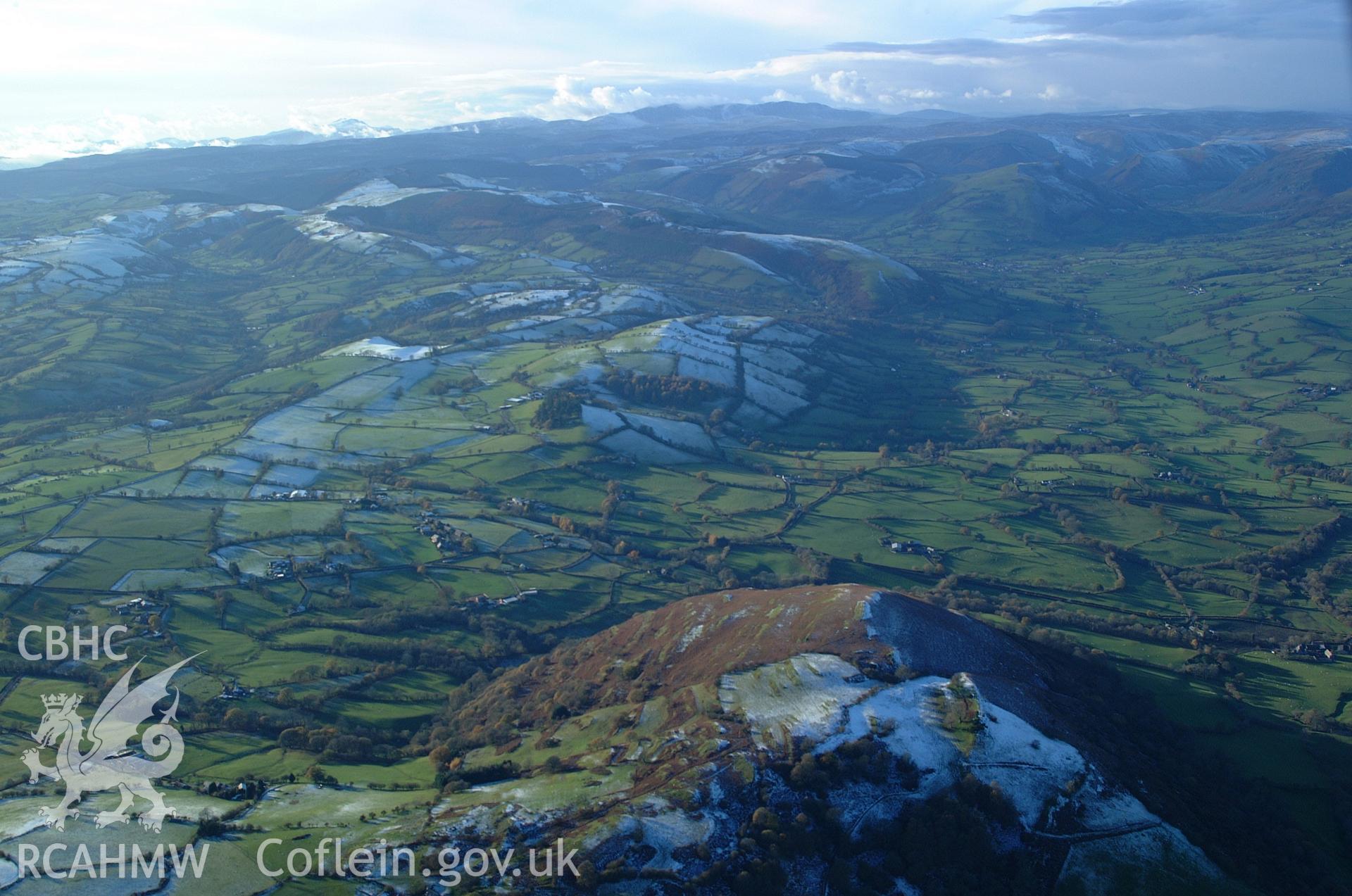 RCAHMW colour oblique aerial photograph of Ty-Newydd Dyke, Tanat Valley, in winter landscape looking west over Rhos-y-Brithdir. Taken on 19 November 2004 by Toby Driver