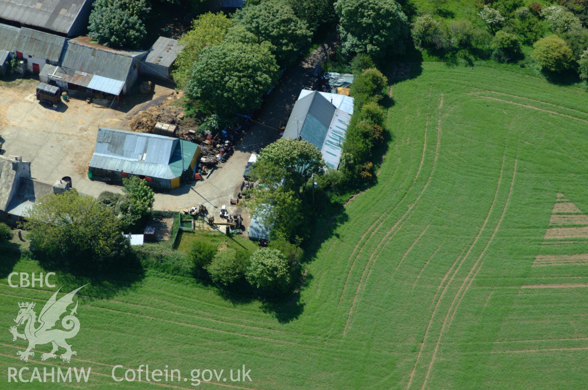 RCAHMW colour oblique aerial photograph of Tre-Howell Burial Chamber at Tre-Howell Farm. Taken on 25 May 2004 by Toby Driver