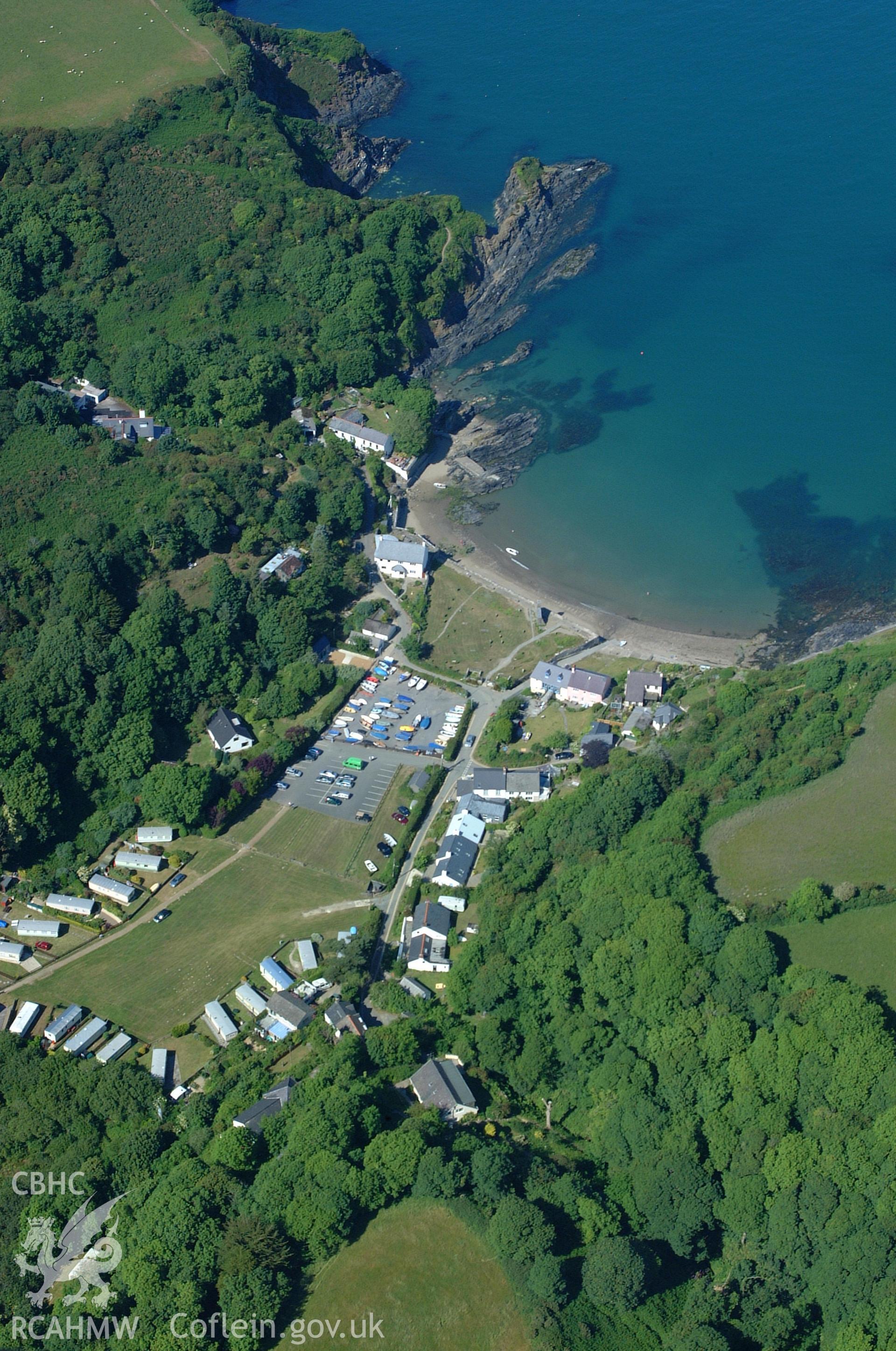 RCAHMW colour oblique aerial photograph of Dinas harbour and Cwm-yr-eglwys taken on 15/06/2004 by Toby Driver