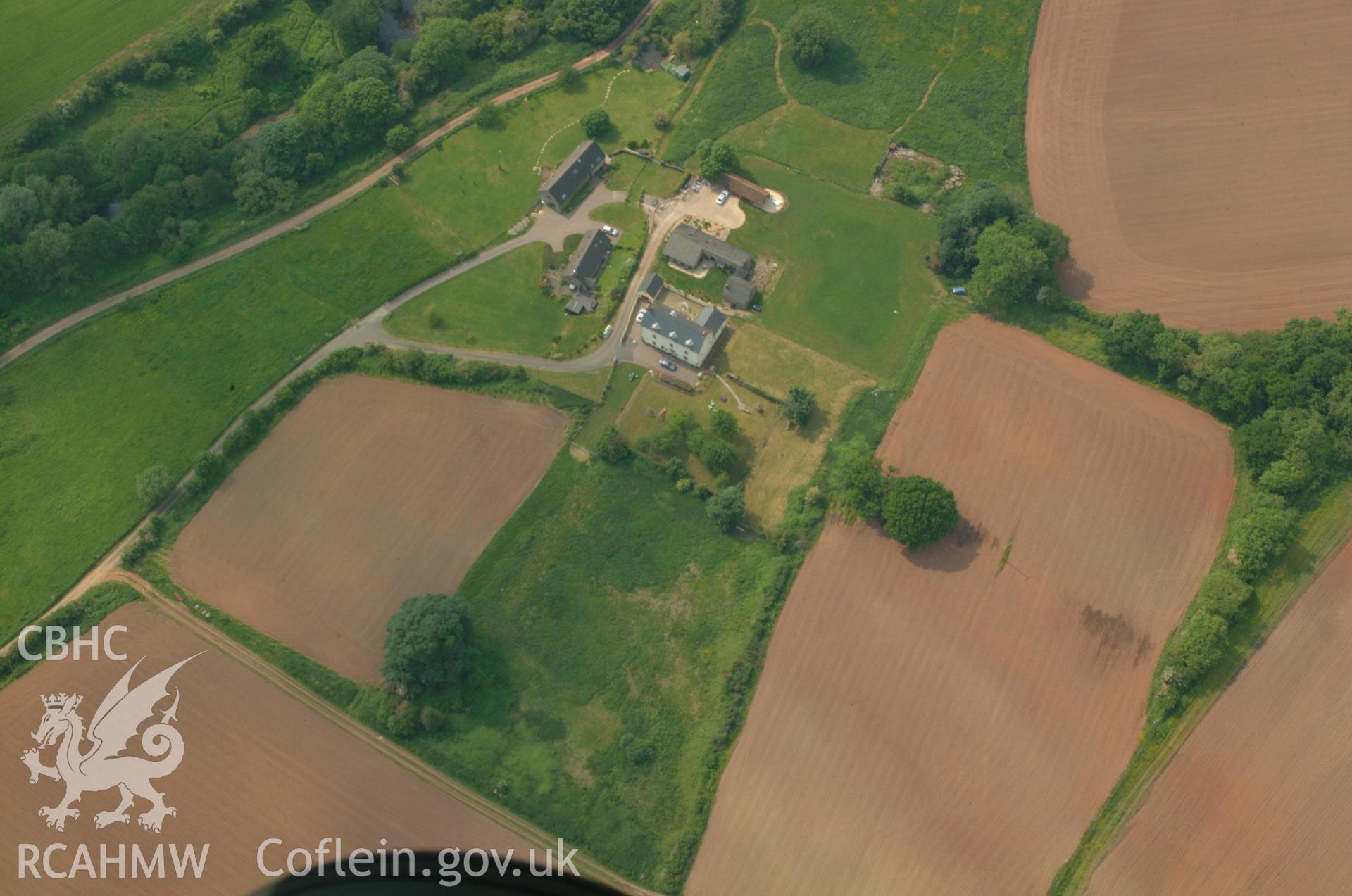 RCAHMW colour oblique aerial photograph of Penrhos Camp Civil War Earthworks taken on 26/05/2004 by Toby Driver