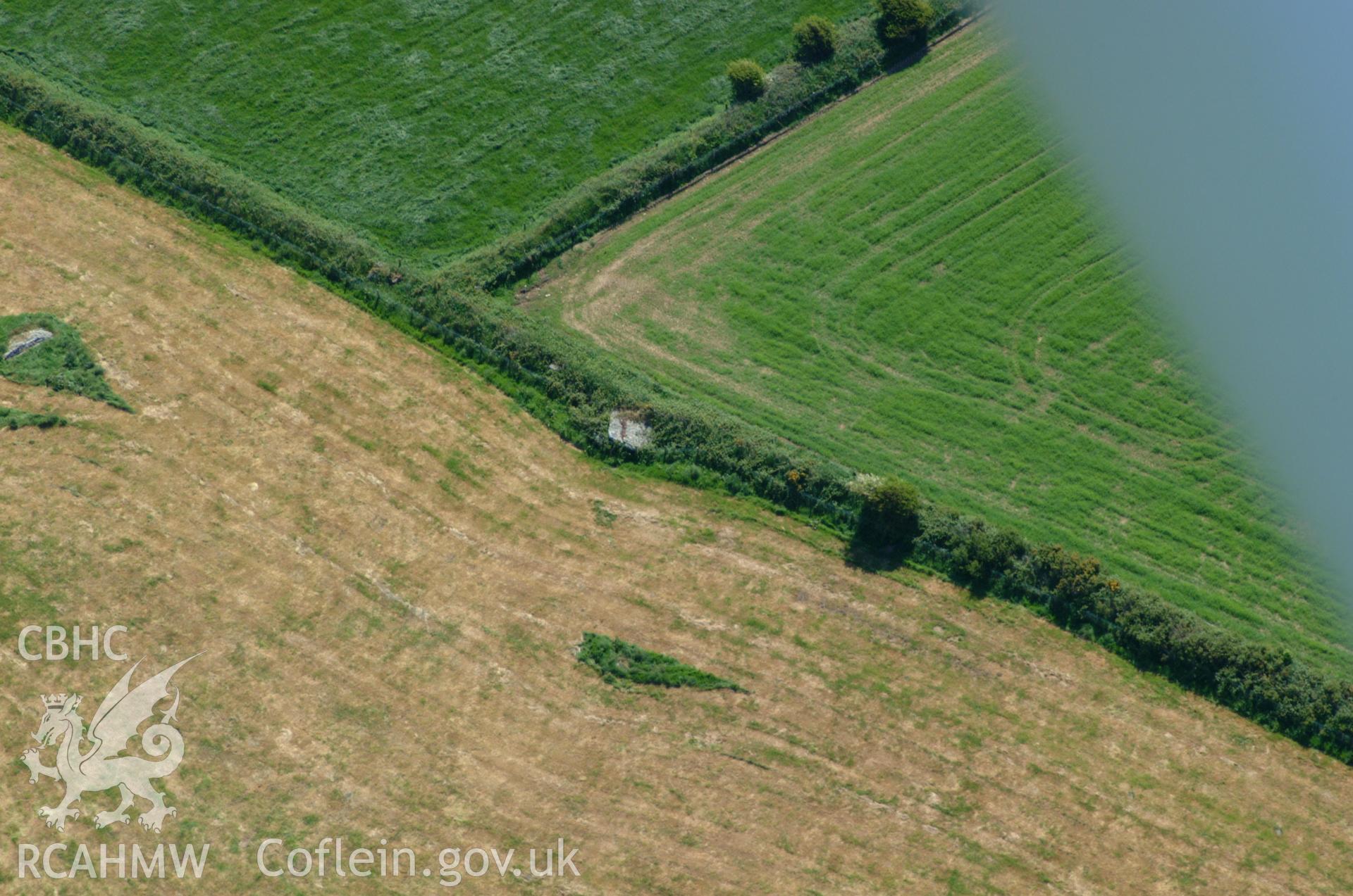 RCAHMW colour oblique aerial photograph of Tre Wallter Llwyd Burial Chamber taken on 25/05/2004 by Toby Driver