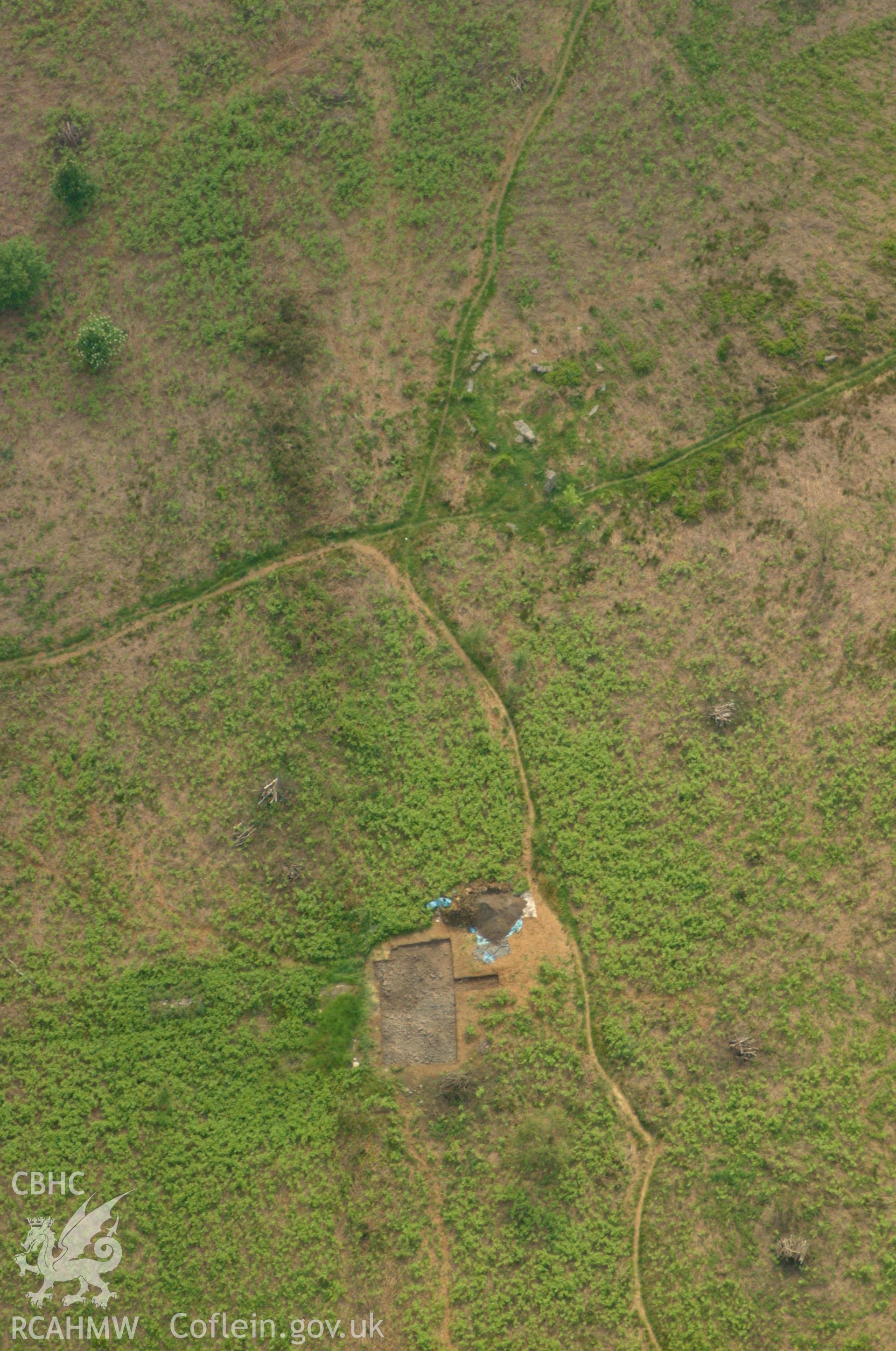 RCAHMW colour oblique aerial photograph of Grey Hill Stone Circle showing excavations by the University of Wales, Newport. Taken on 26 May 2004 by Toby Driver