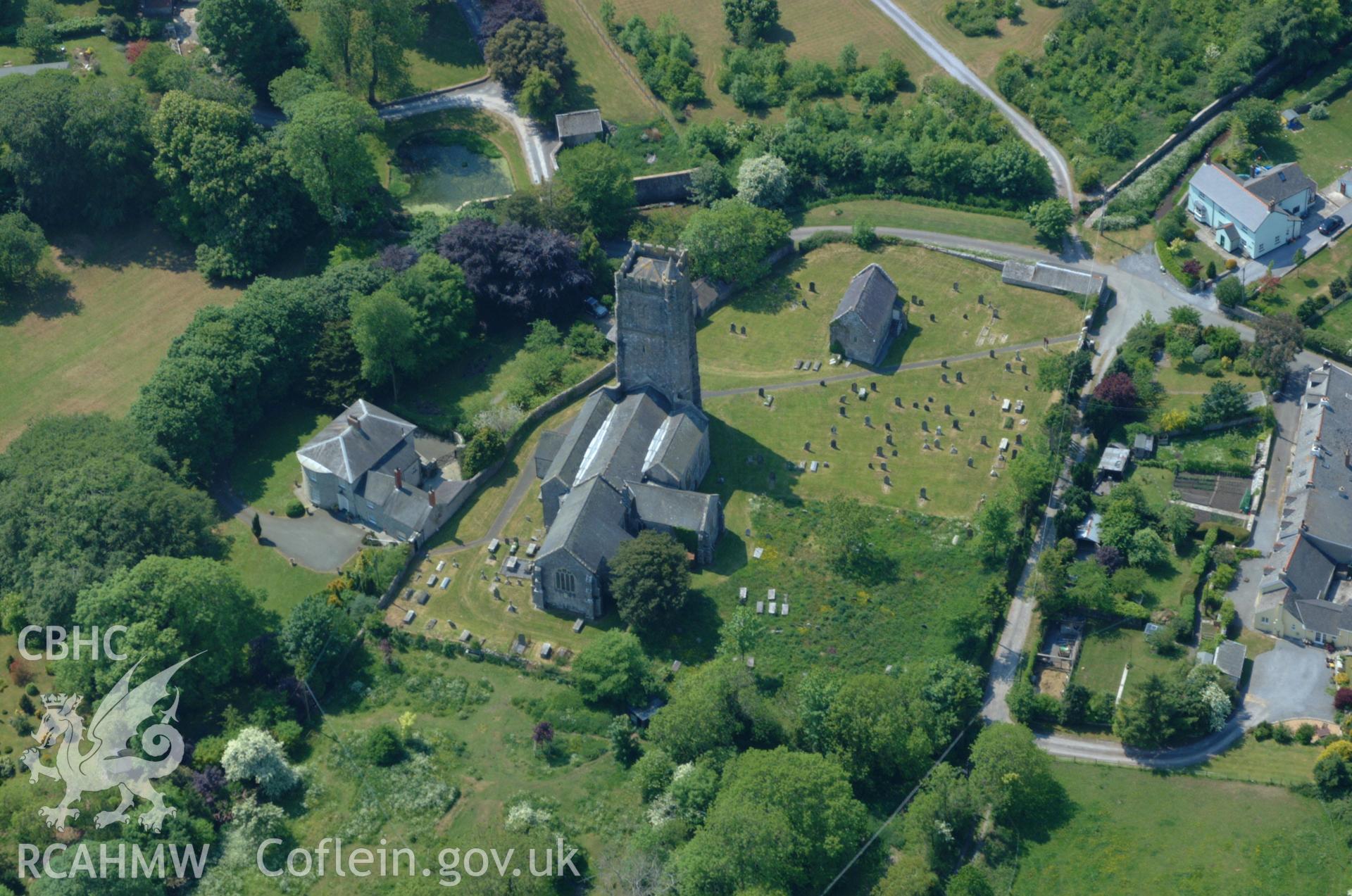 RCAHMW colour oblique aerial photograph of St Mary's Church, Carew Cheriton. Taken on 24 May 2004 by Toby Driver